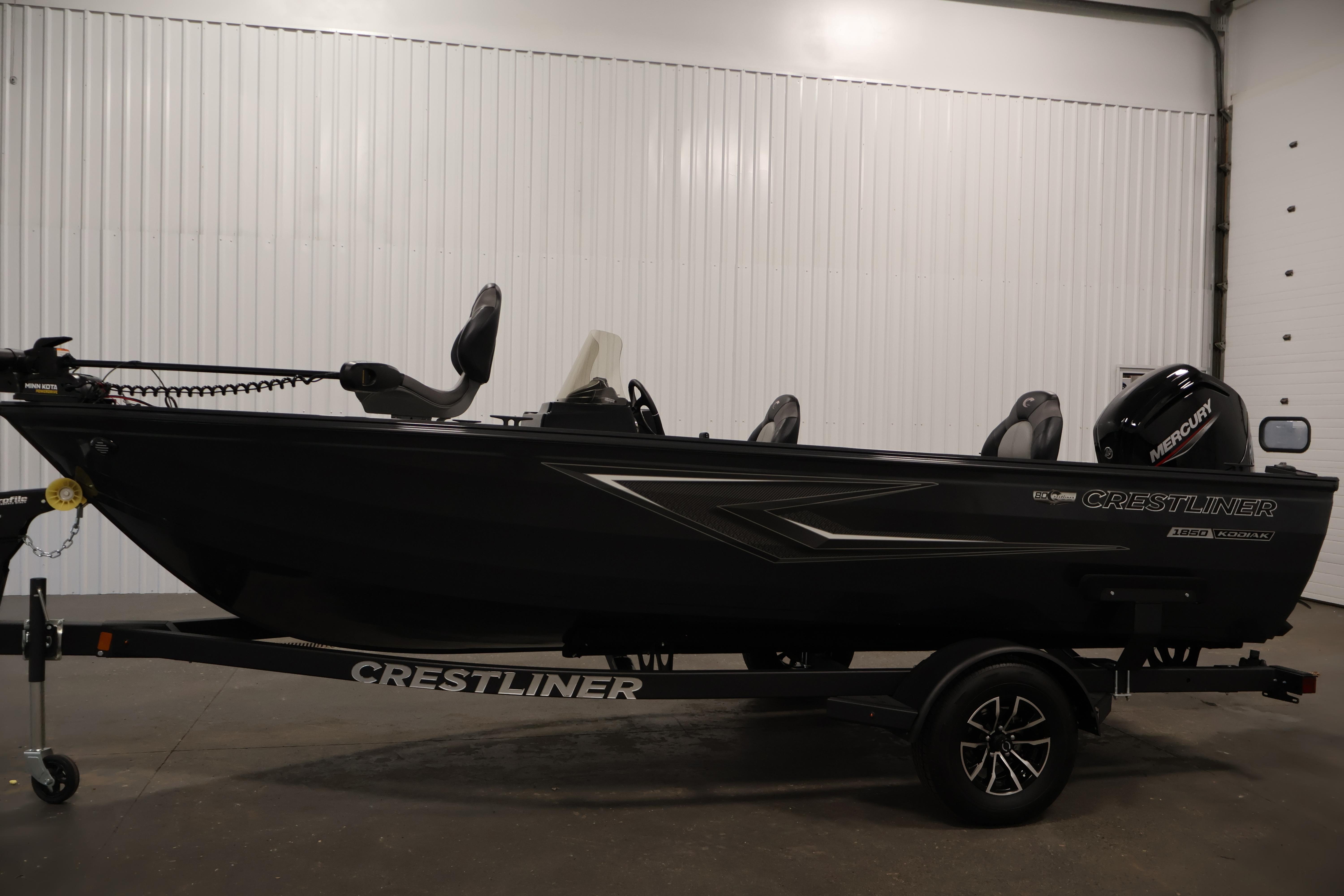 2026 Crestliner 1850 Kodiak SC fishing boat on trailer in indoor setting.