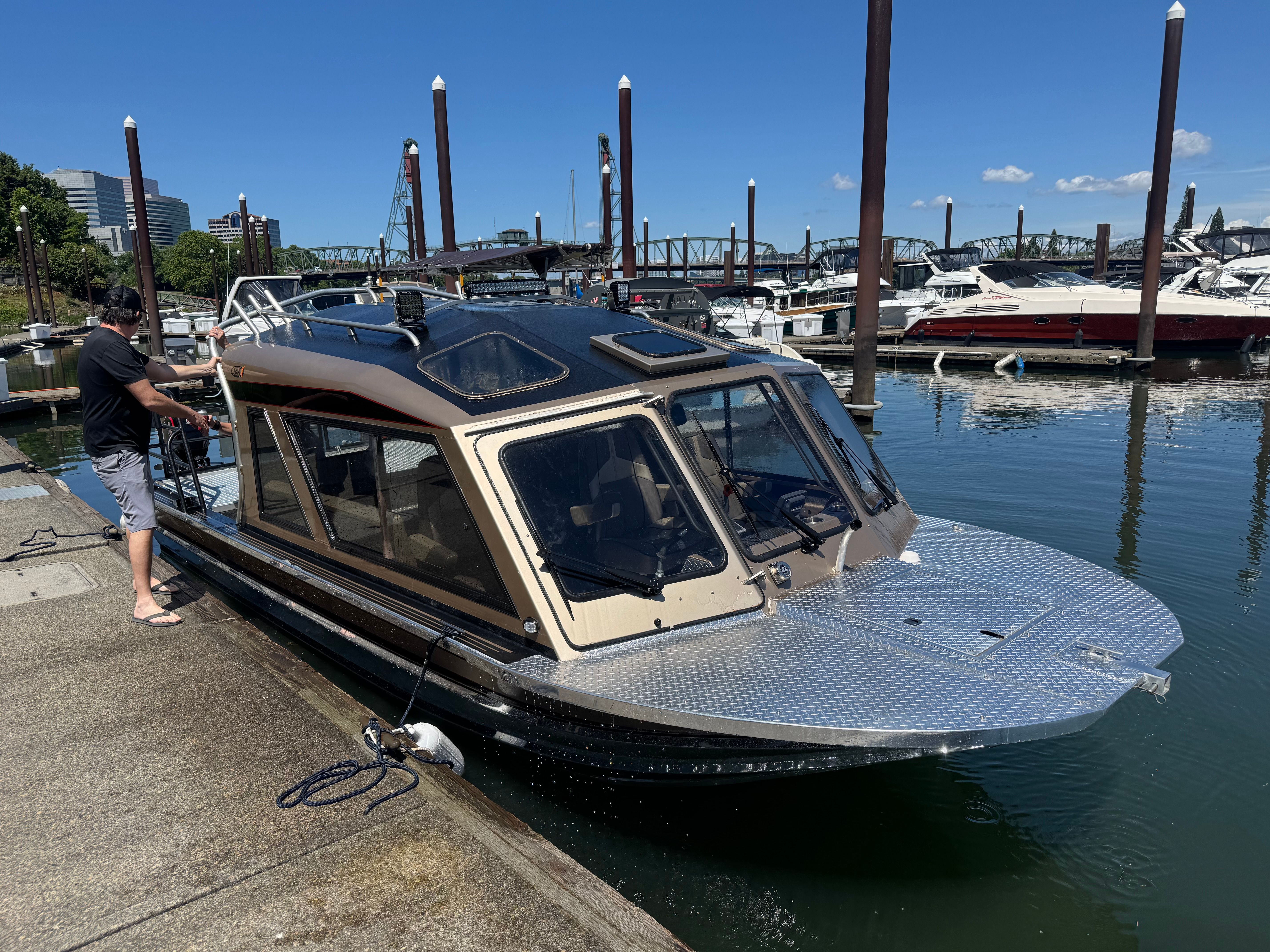 Custom RMX 24 boat from 2011 docked at marina.