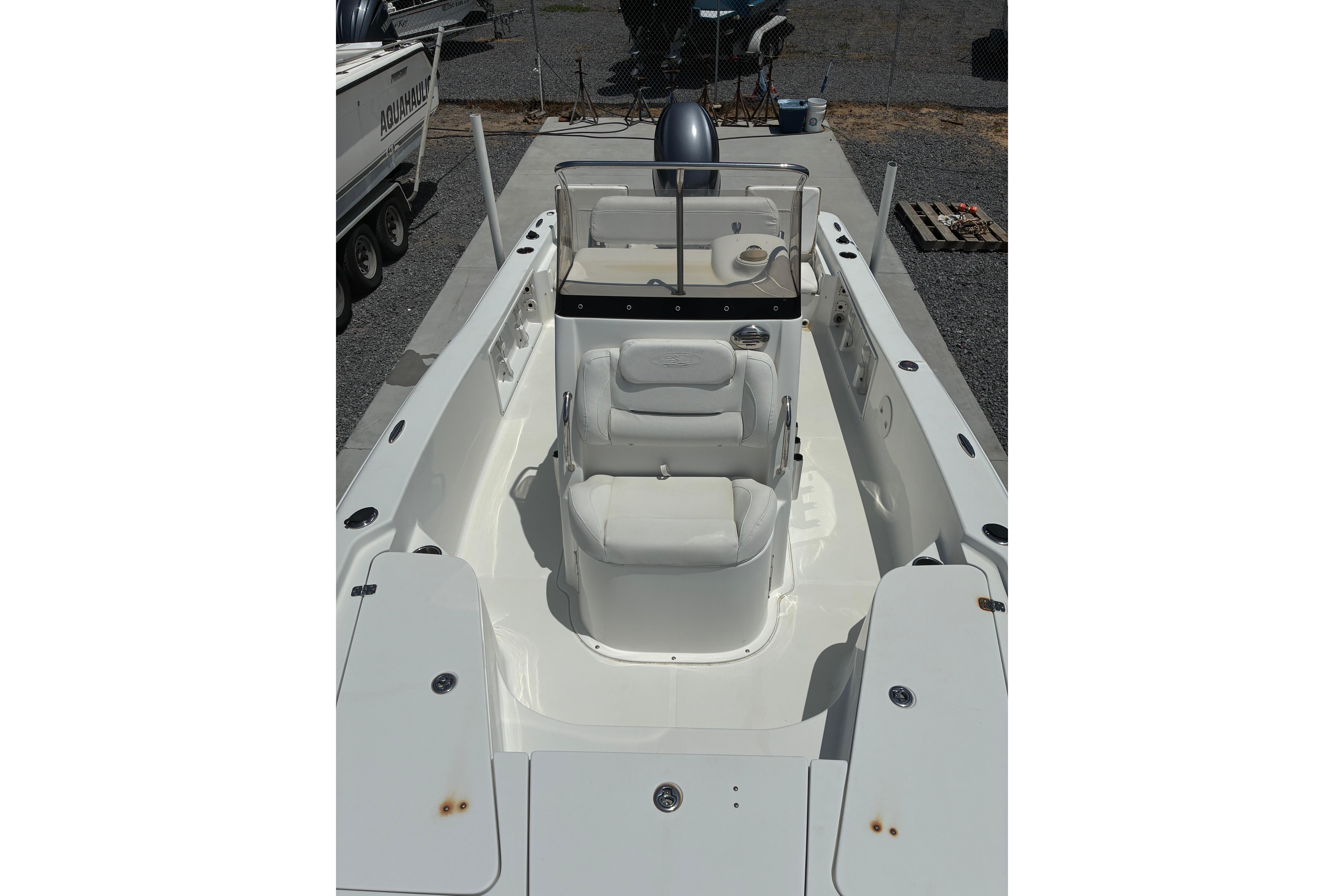 2014 Sea Hunt BX 20 BR boat interior with white seating and console.