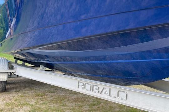 2017 Robalo R222 Center Console boat on trailer, blue hull visible.