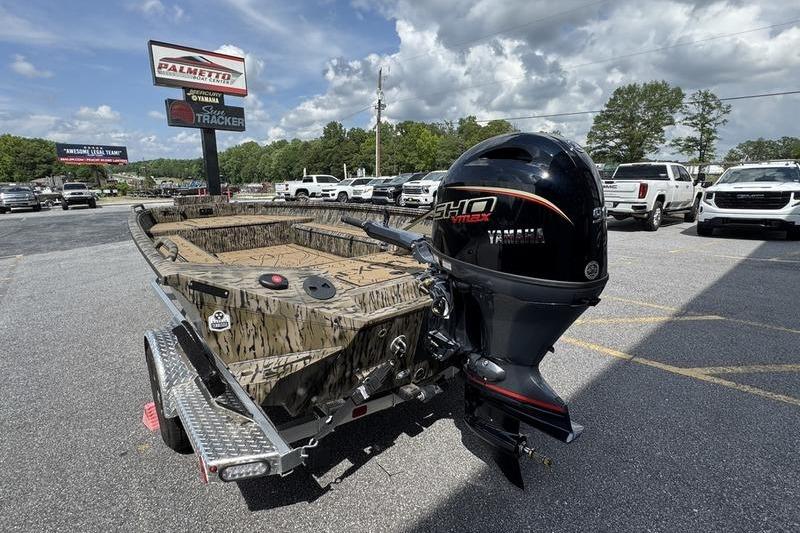 2026 Excel 183 Tomahawk boat with Yamaha engine on trailer at dealership.