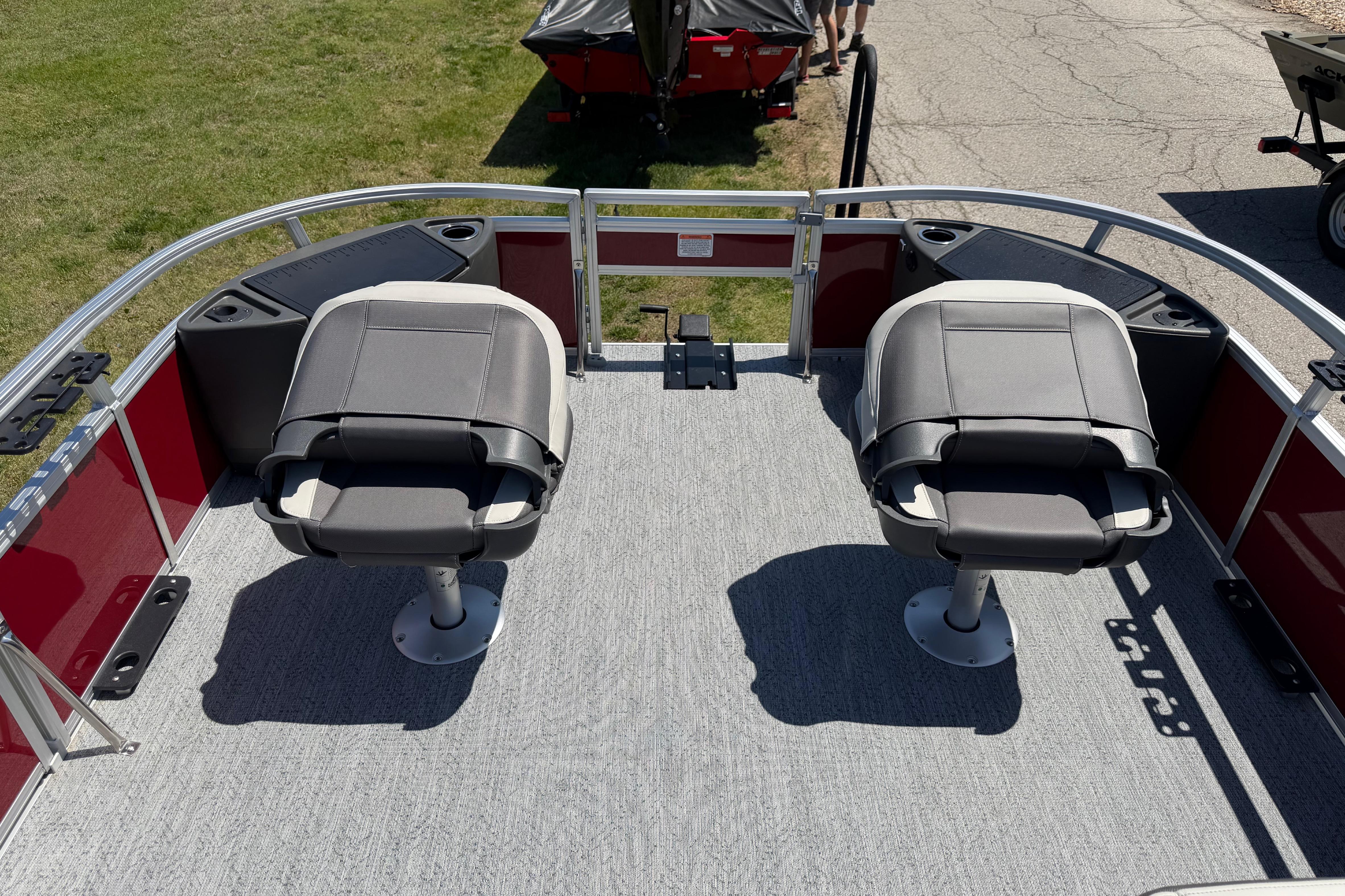 2026 Sun Tracker Bass Buggy 18 DLX pontoon boat with dual swivel seats.
