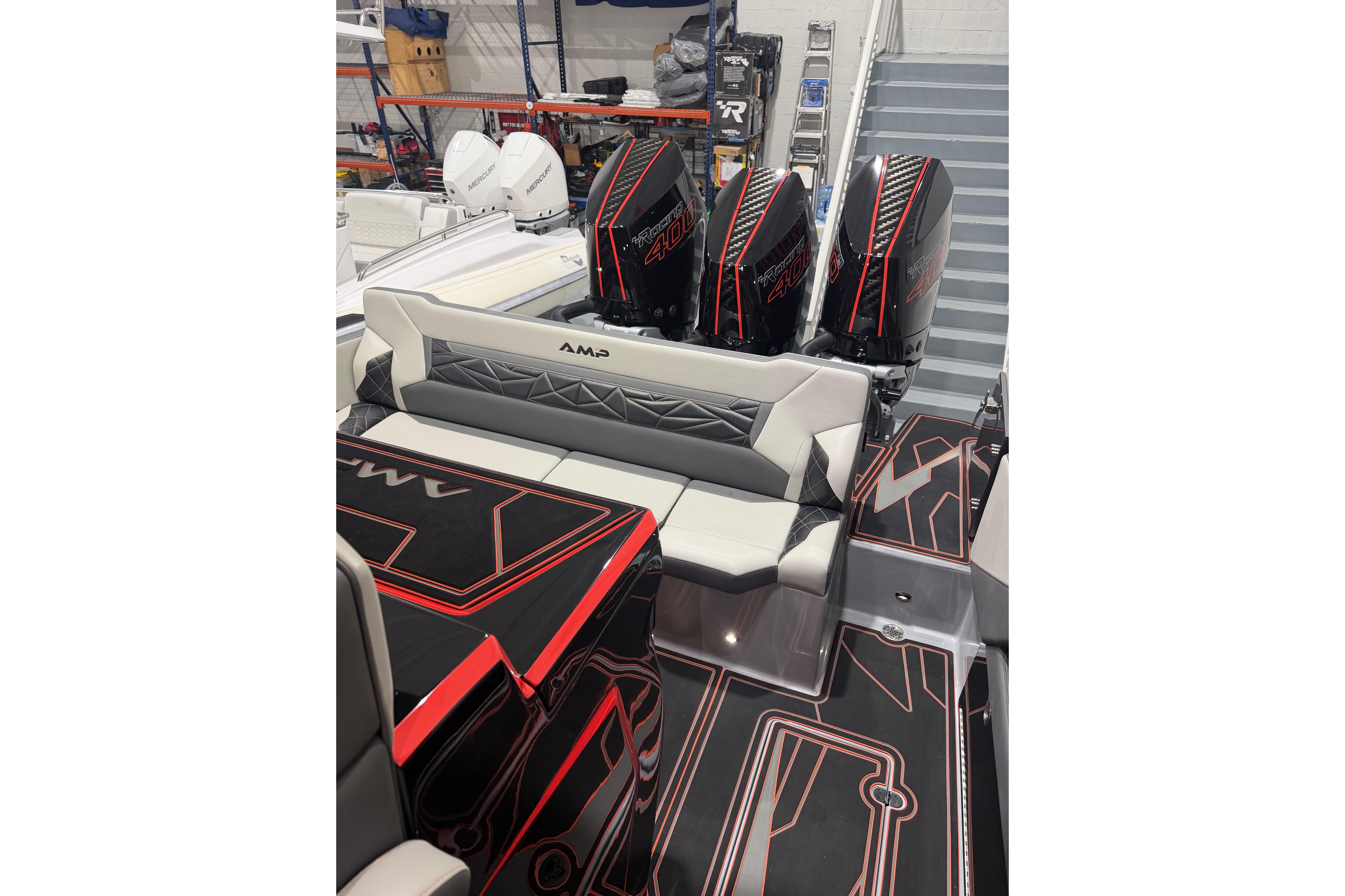 2026 AMP 333 boat with triple Mercury Racing 400R engines, sleek design, and modern seating.