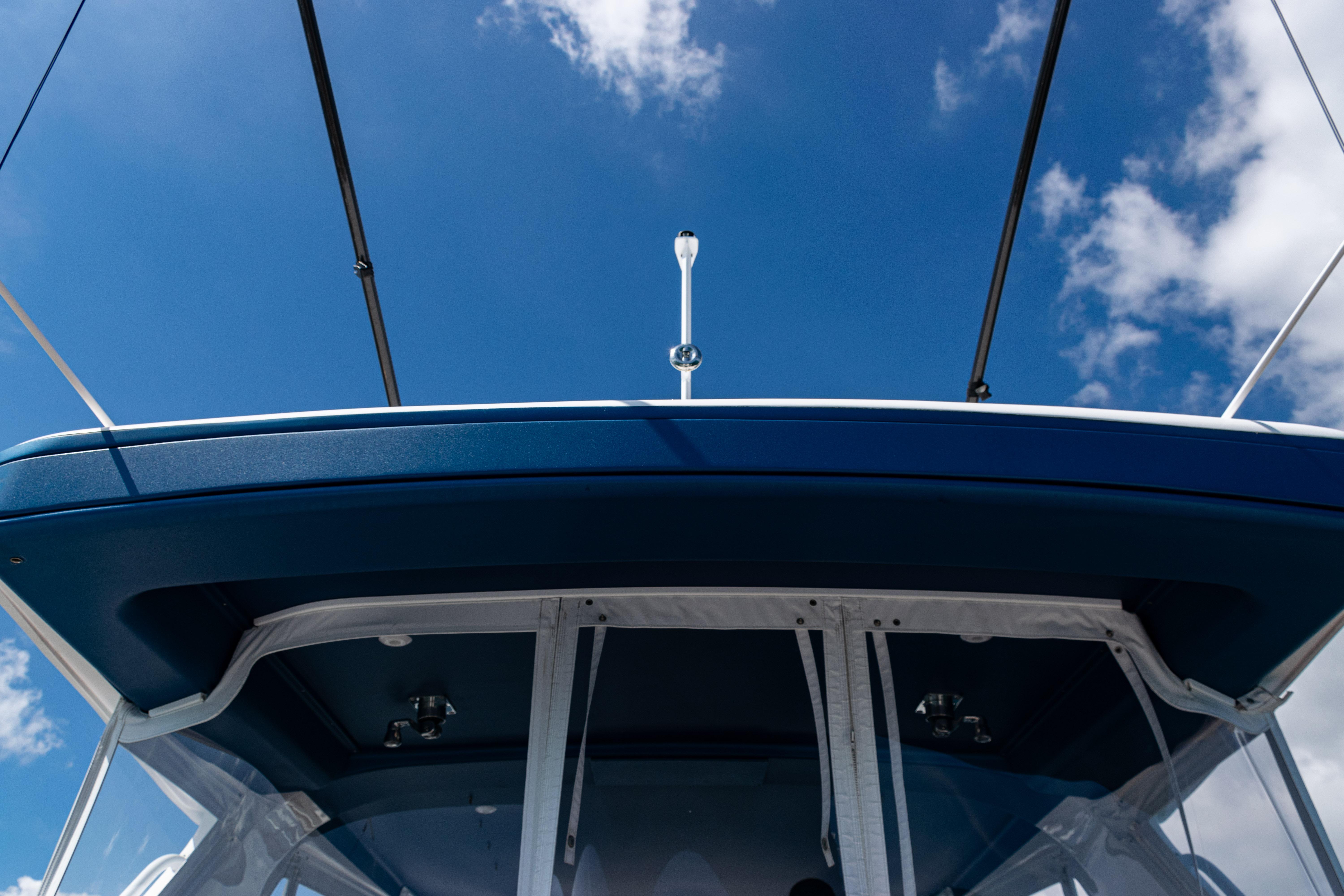 2018 Intrepid 438 Evolution boat against a clear blue sky.