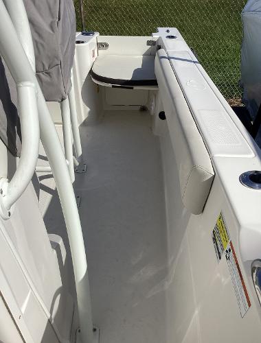 2022 Sailfish 220 CC boat interior with white seating and clean deck.