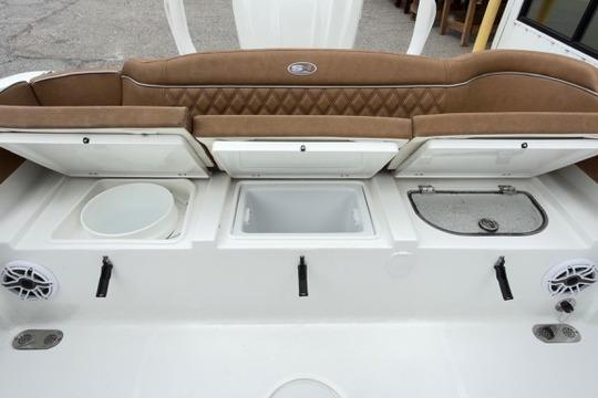 2026 Sea Hunt Ultra 255 SE boat interior with storage compartments and seating.