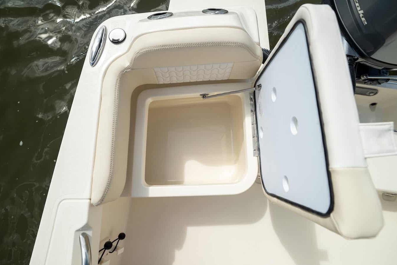 2026 Scout 188 Sportfish boat with open storage compartment, showcasing interior design.