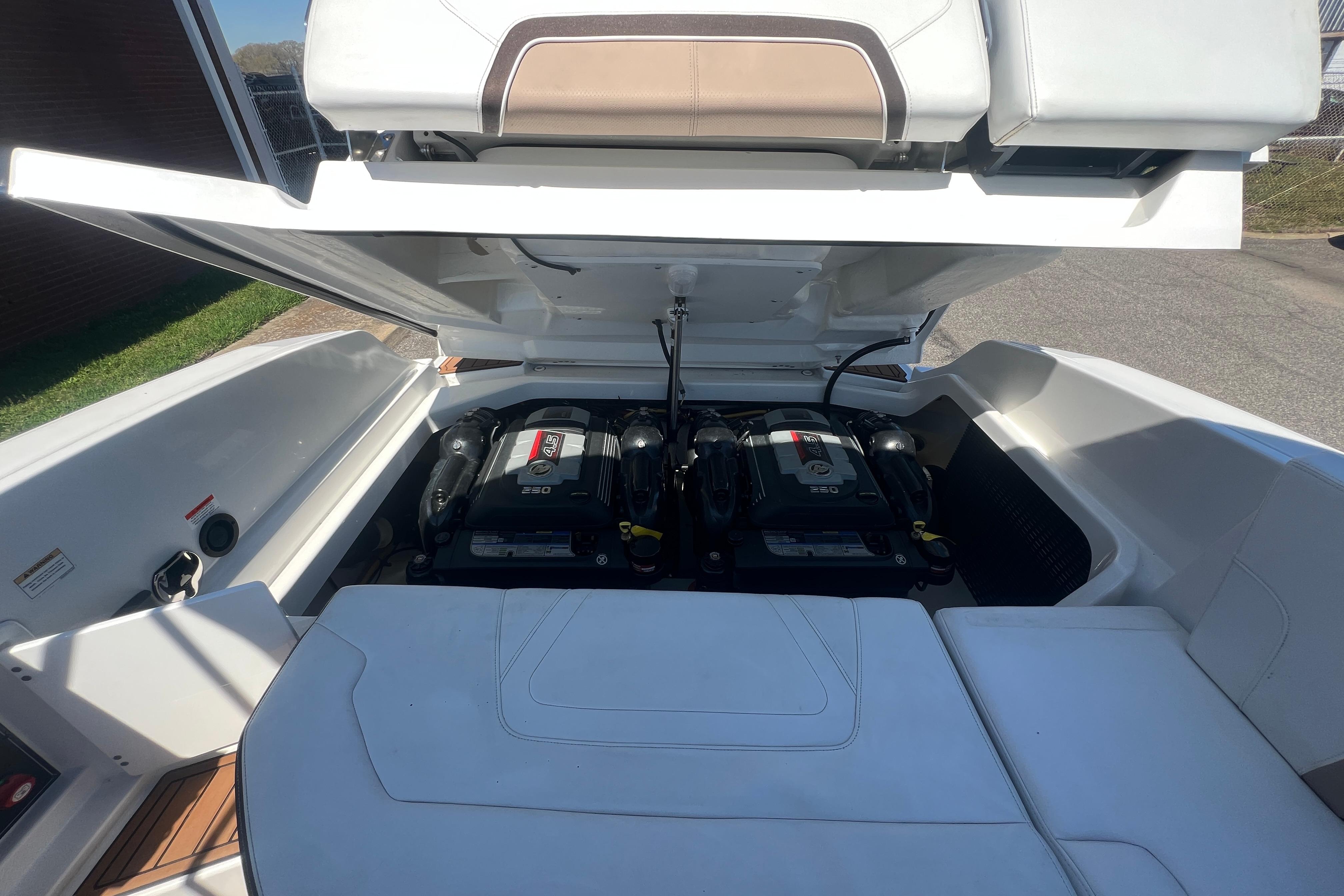 2017 Monterey 298SS Super Sport boat engine compartment with dual engines visible.