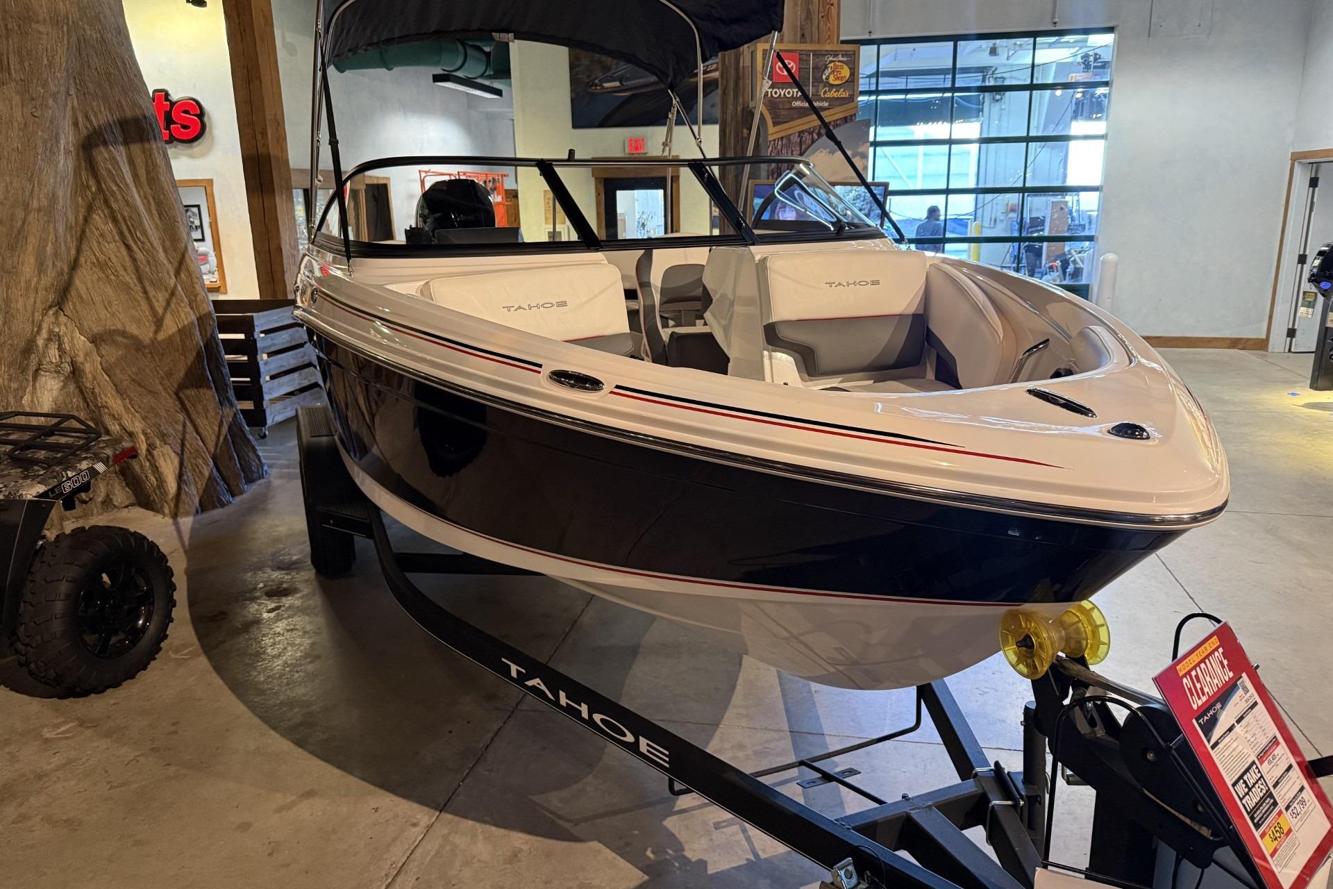 2024 Tahoe 210 S boat displayed indoors on a trailer.