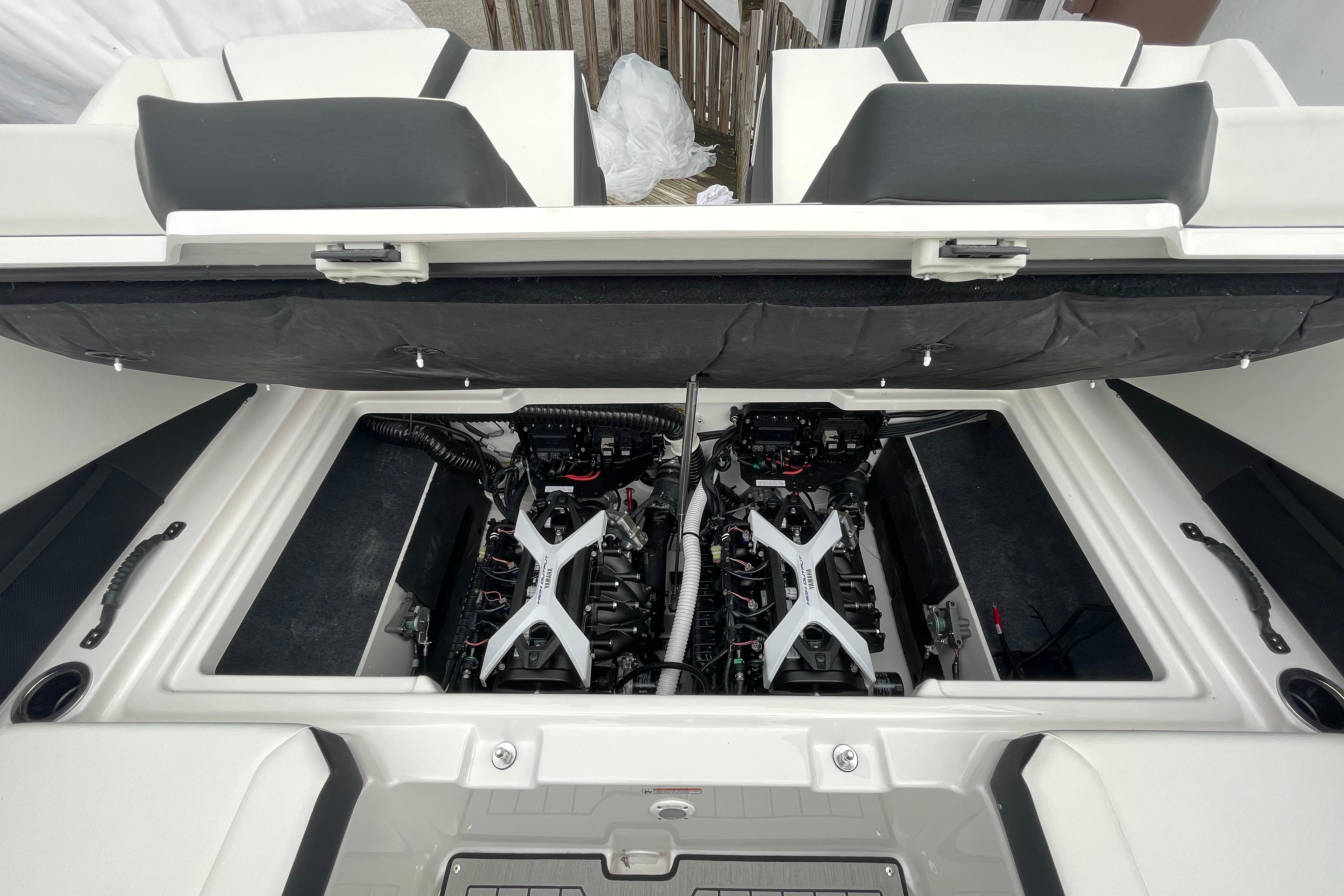2026 Yamaha Boats 222S engine compartment with dual engines and open hatch.