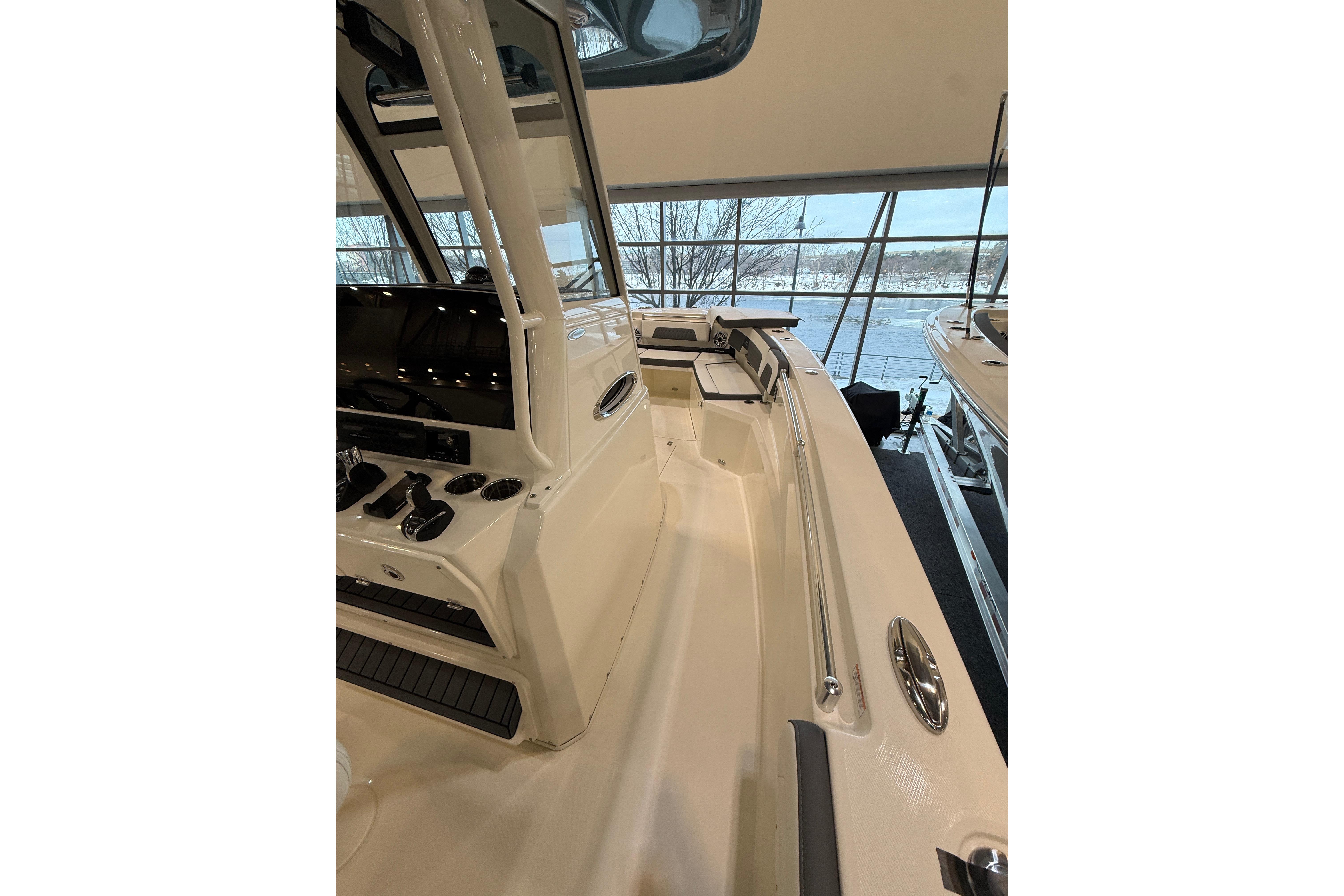 2026 Cobia 285 Center Console boat interior with modern controls and spacious deck.