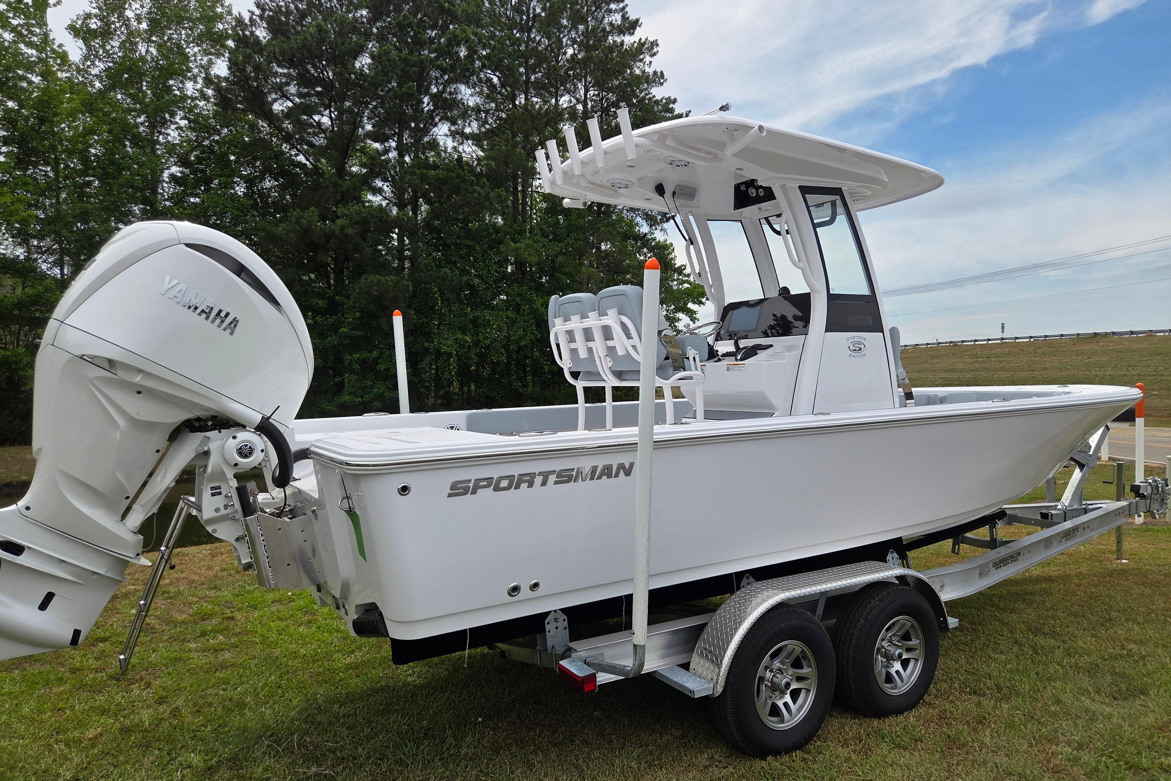 2026 Sportsman Masters 247OE Bay Boat with Yamaha engine on trailer.