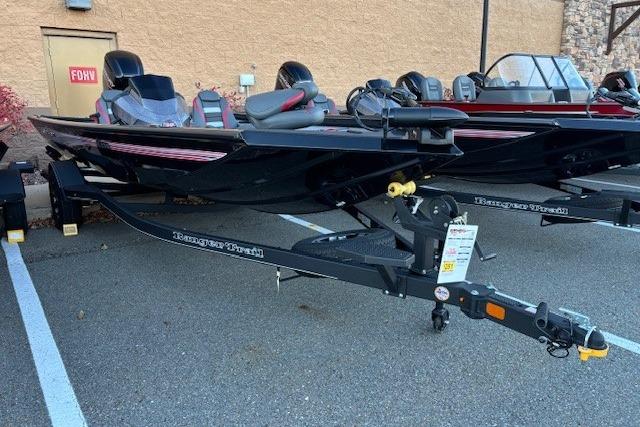 2025 Ranger RT178 boat on trailer, parked outdoors, side view.