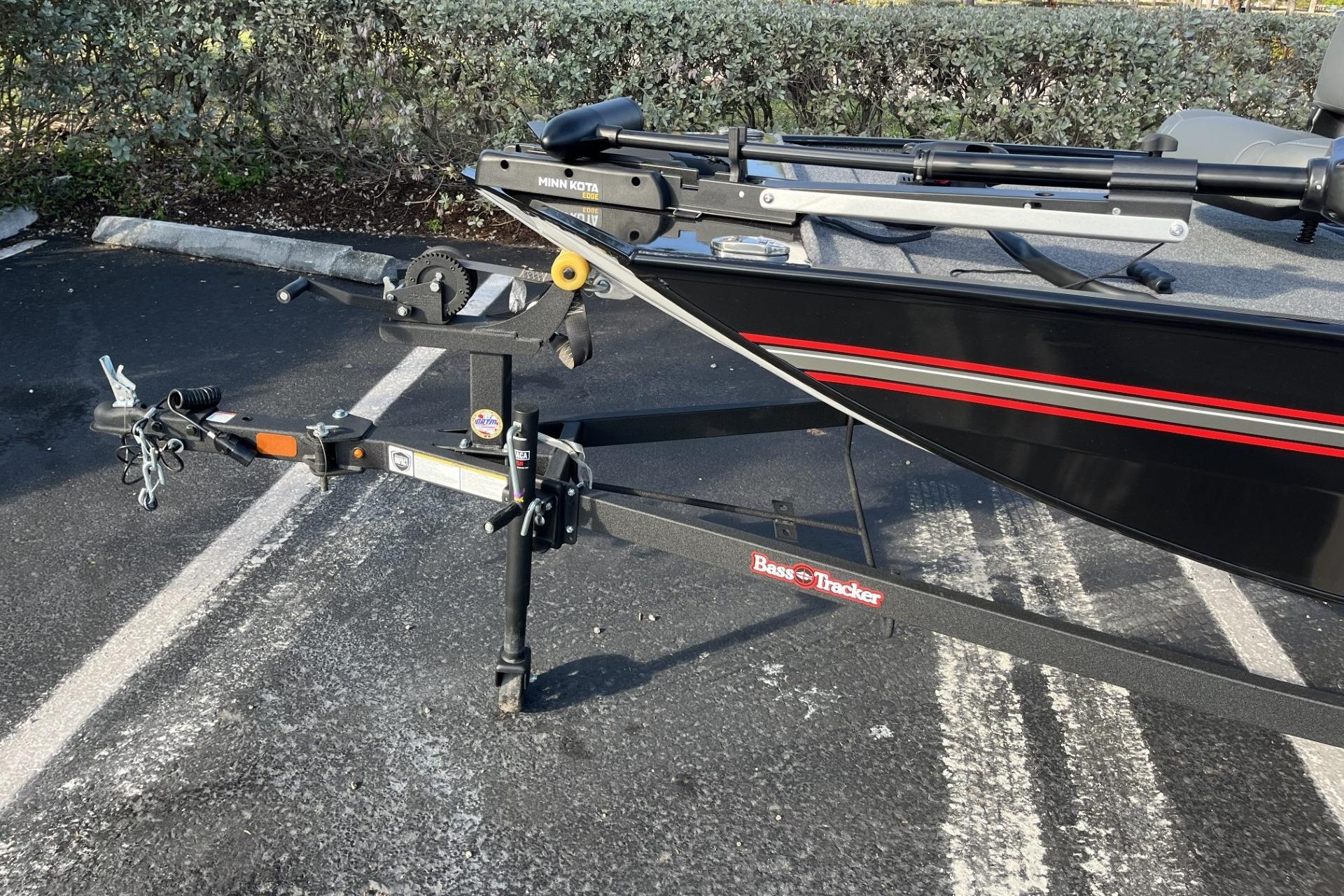 2026 Tracker Bass Tracker Classic XL boat on trailer in parking lot.