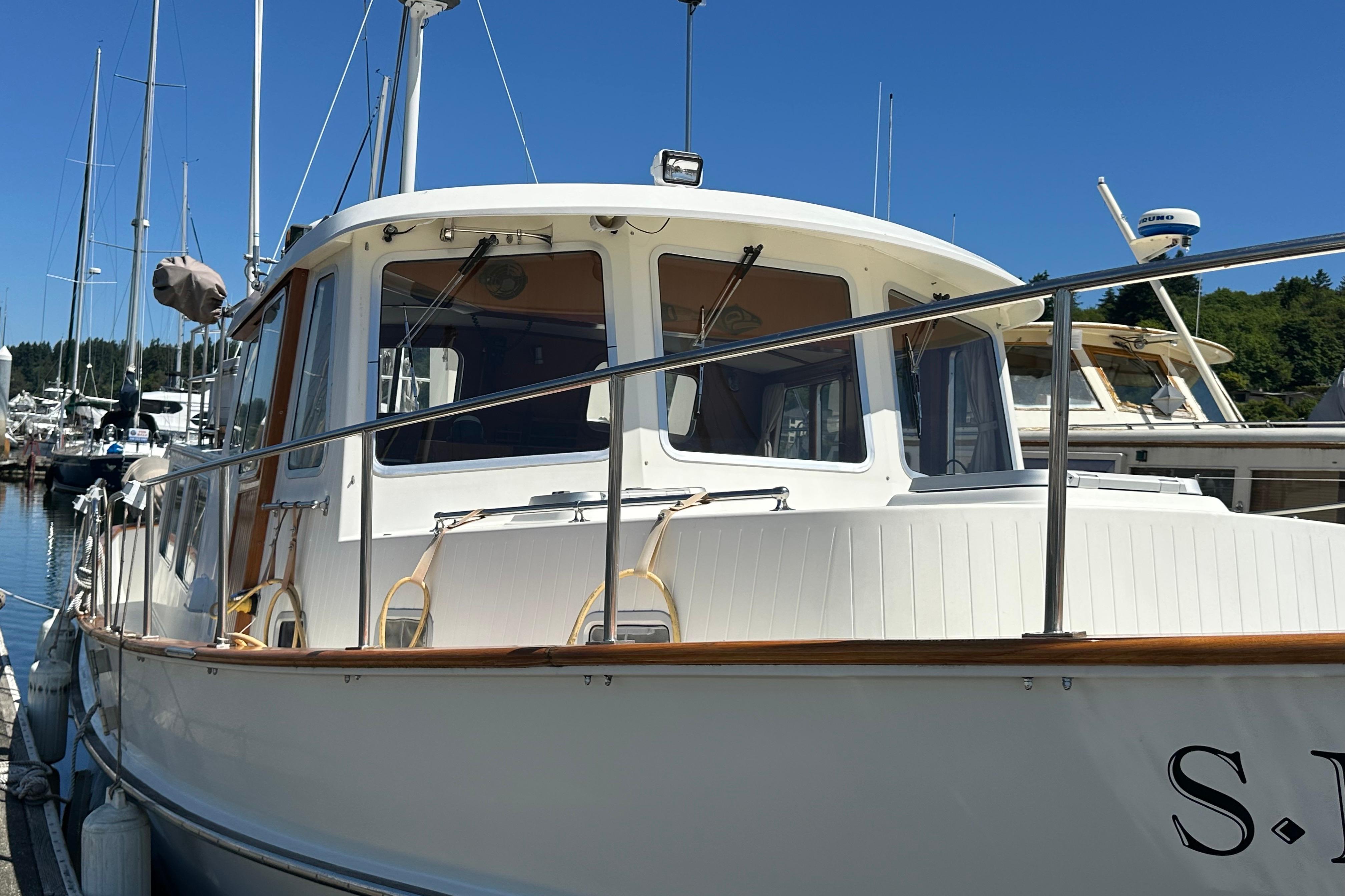 2000 Eagle 40 Pilothouse Trawler docked at marina under clear blue sky.