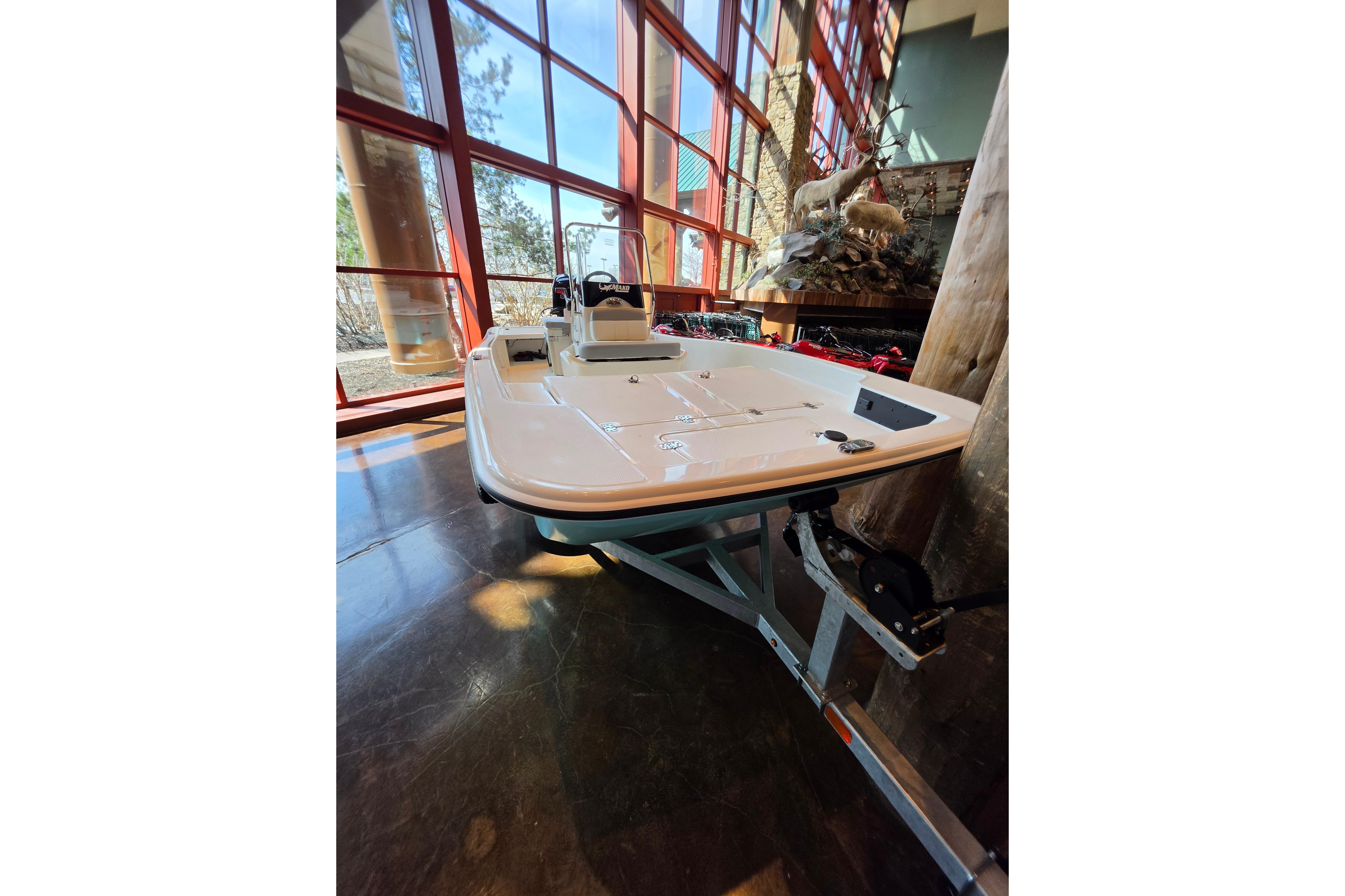 2026 Mako Pro Skiff 15 CC boat displayed indoors with natural lighting.