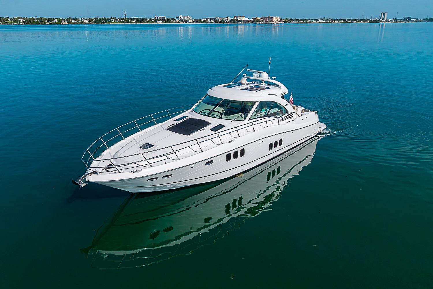 2008 Sea Ray 60 Sundancer yacht cruising on calm blue waters.