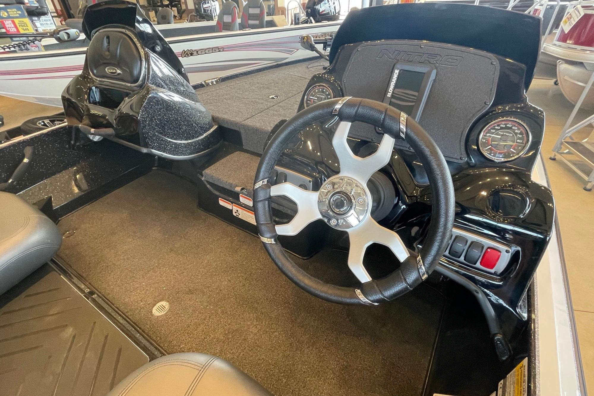 2026 Nitro Z17 boat cockpit with steering wheel and dashboard controls.