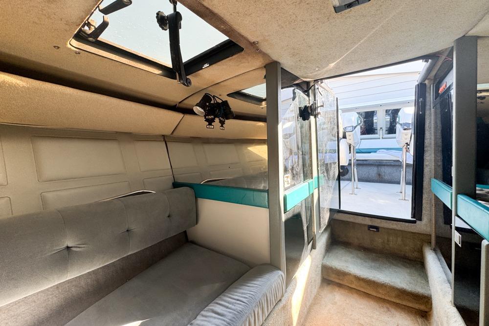 Interior of a 1989 Formula 292 SR-1 boat, featuring seating and skylights.