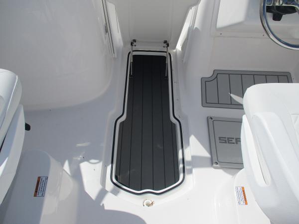 Interior of 2025 Sea Fox 228 Traveler boat, featuring sleek flooring and seating.