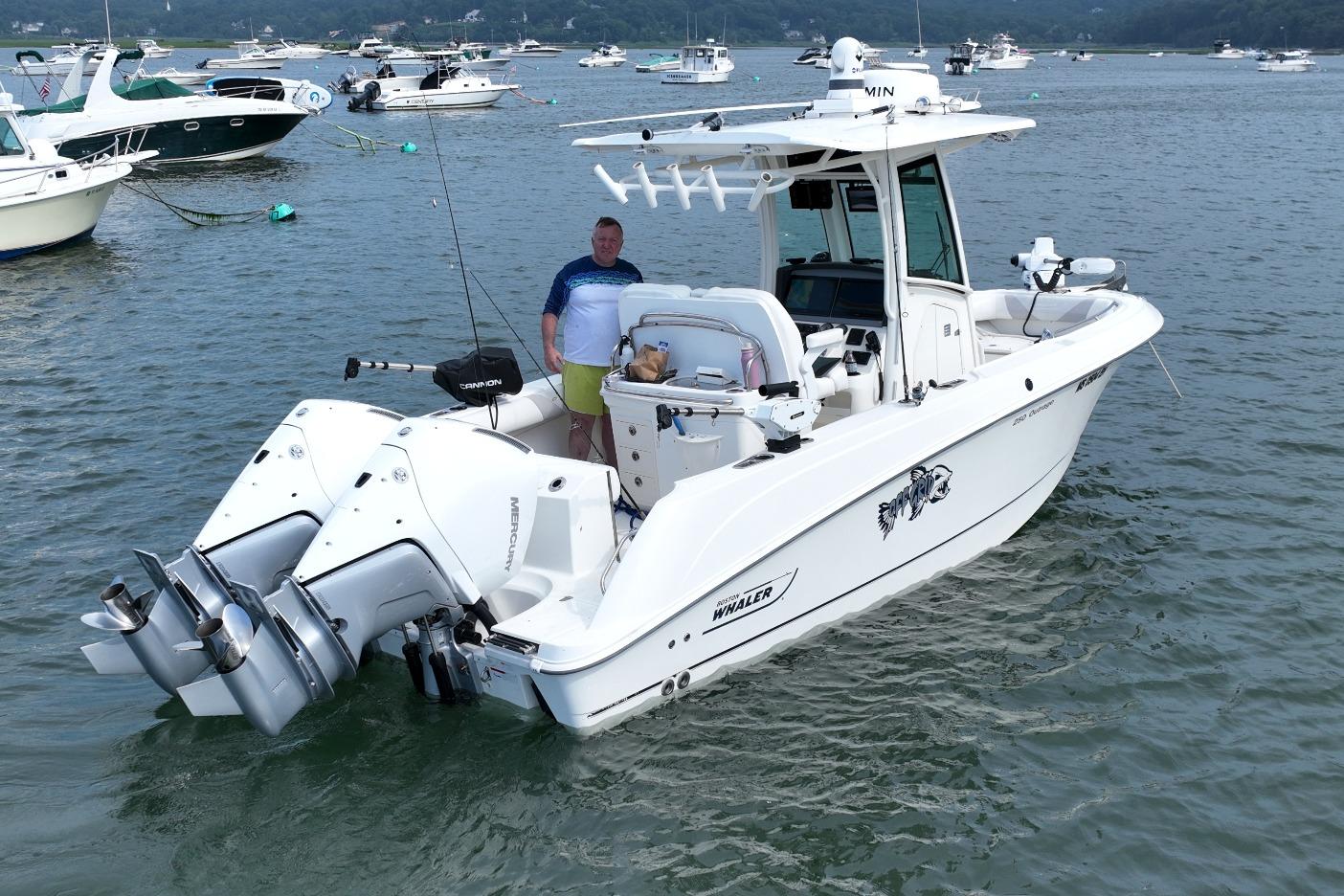 2023 Boston Whaler 250 Outrage boat on water, featuring dual Mercury engines.