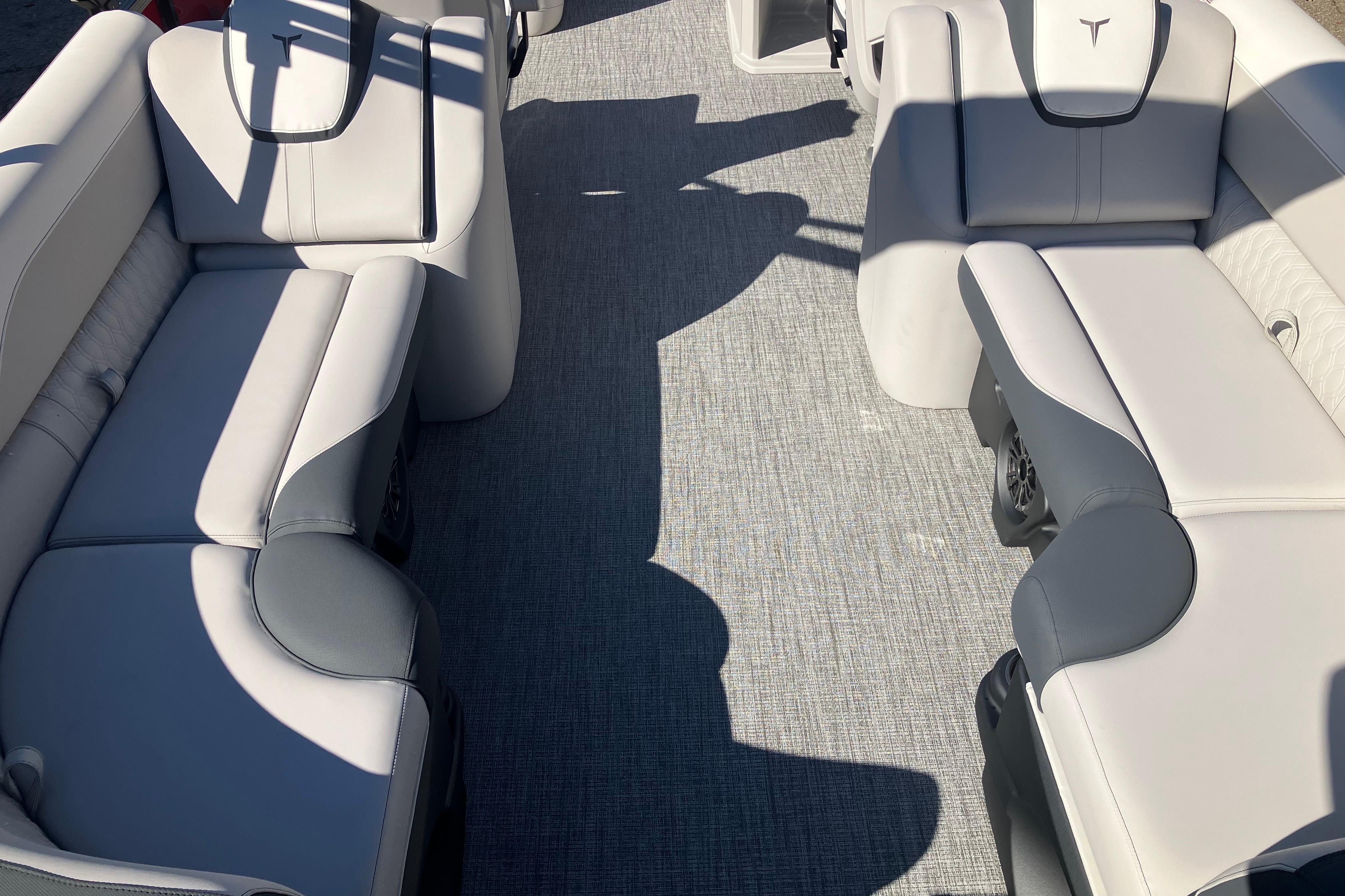 2026 Tahoe Pontoon LTZ Quad Lounger interior with gray seating and carpet flooring.