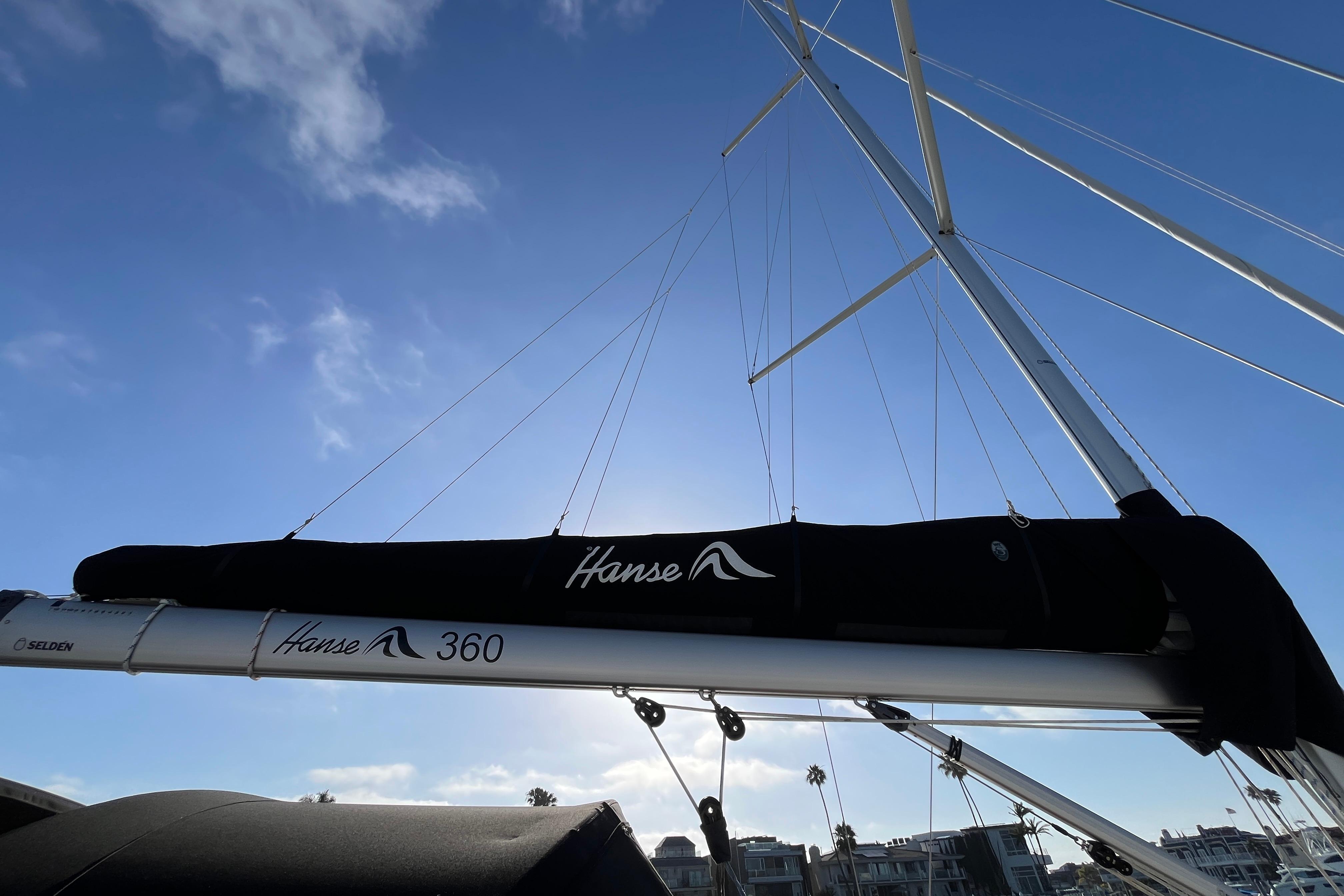 Sailboat mast of 2025 Hanse 360 against a clear blue sky.