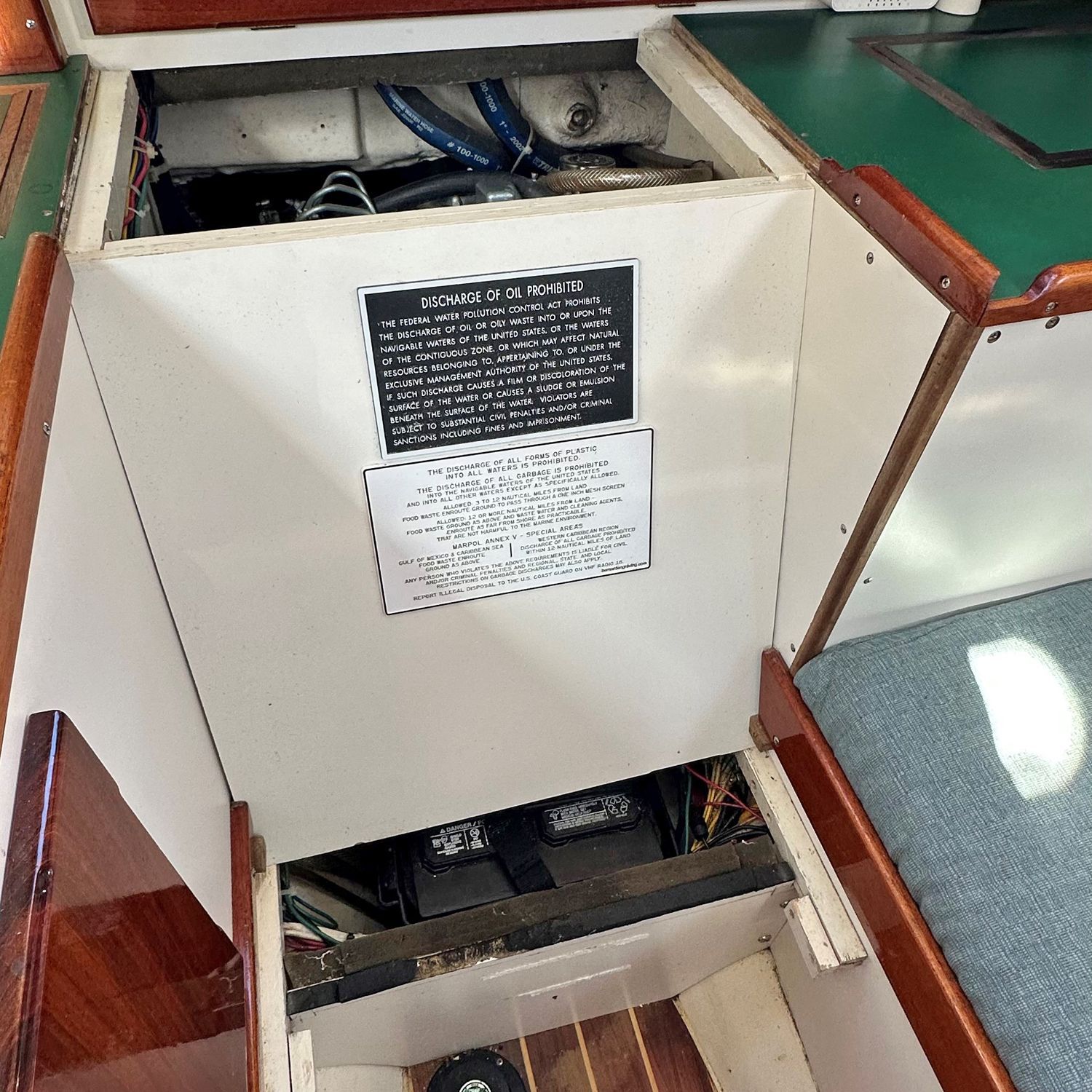 Interior of a 1965 Pearson Triton with access to engine and batteries.