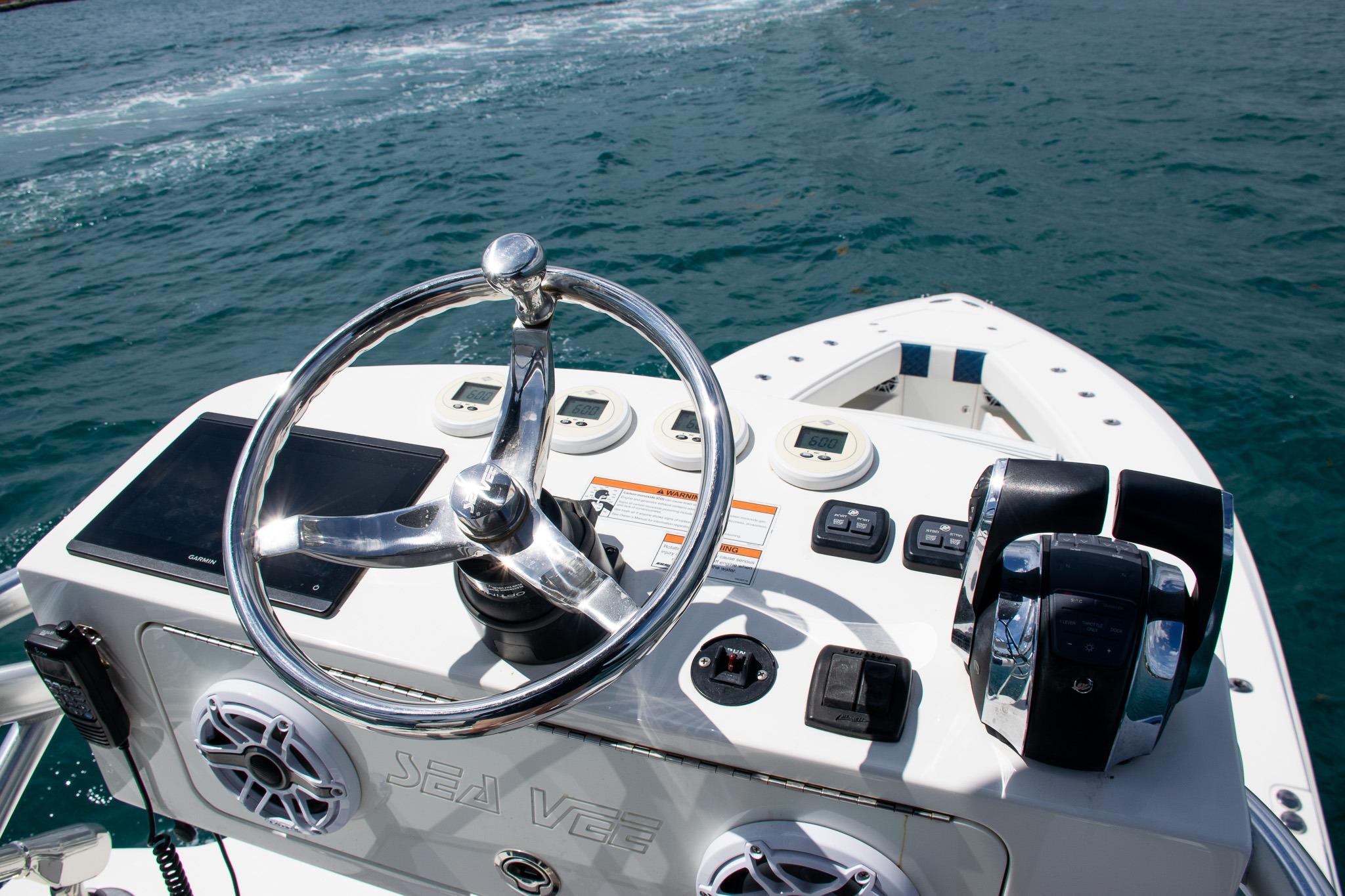 Steering console of 2022 SeaVee 390Z boat on open water.