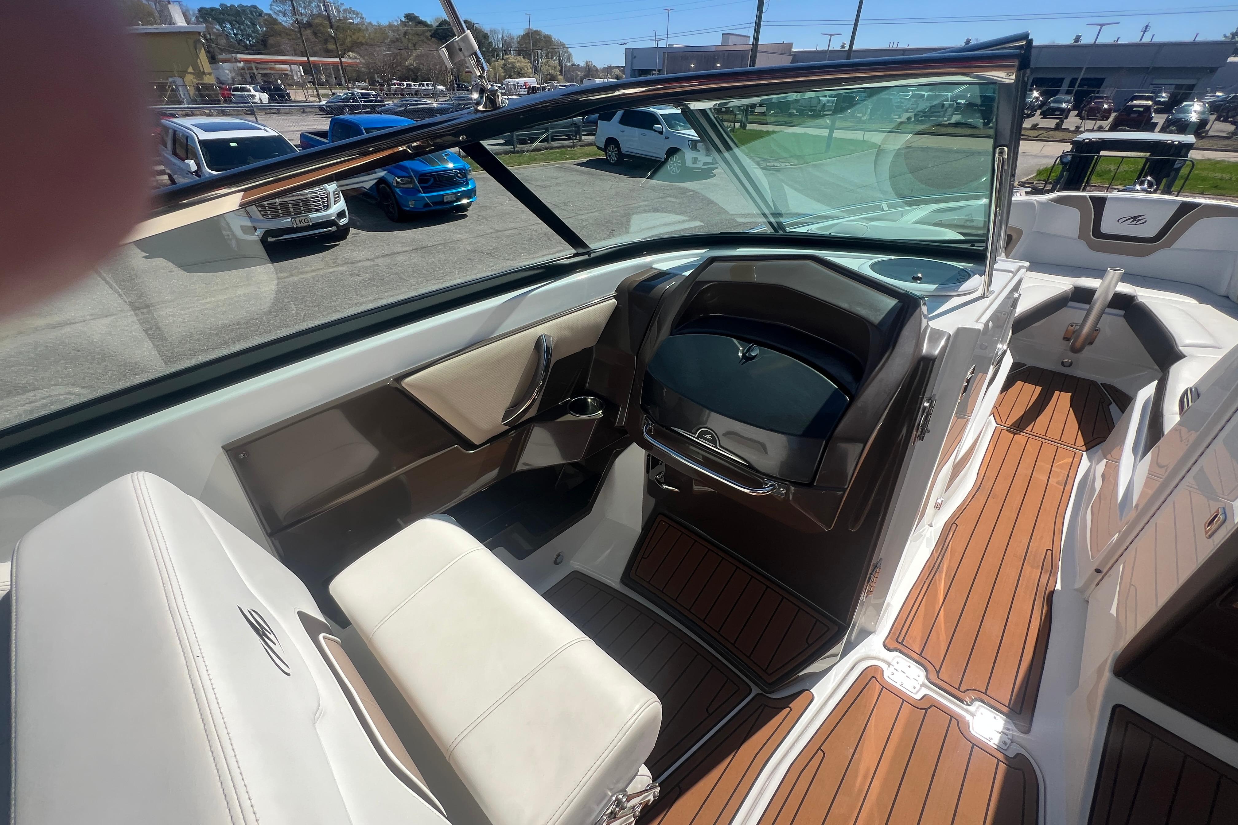 Interior of a 2017 Monterey 298SS Super Sport boat with sleek seating and wood flooring.