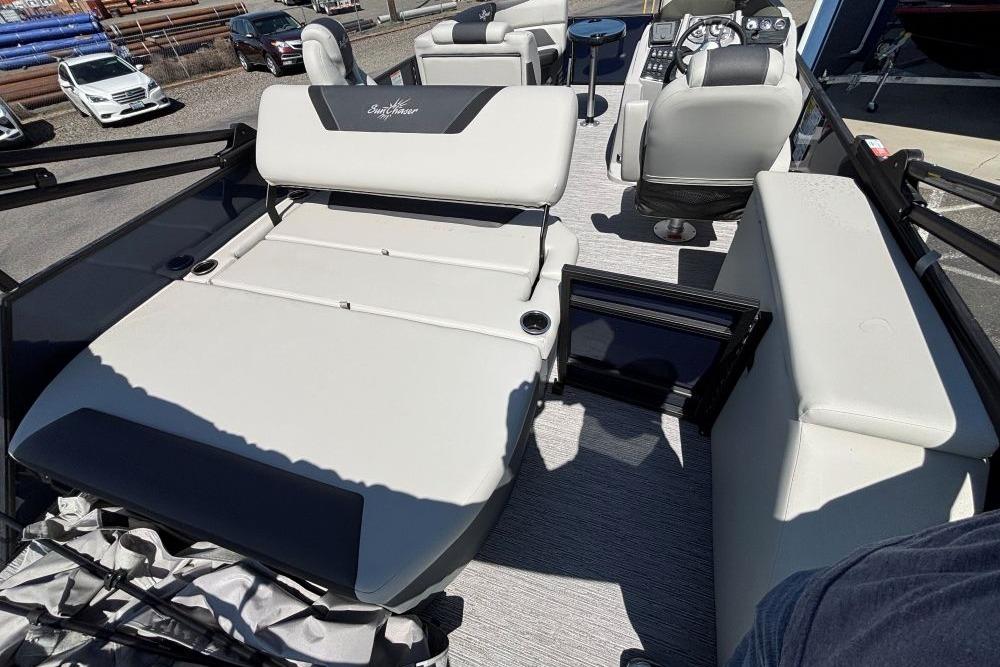 2026 SunChaser Geneva Sport 21 SB DH boat interior with seating and control panel.
