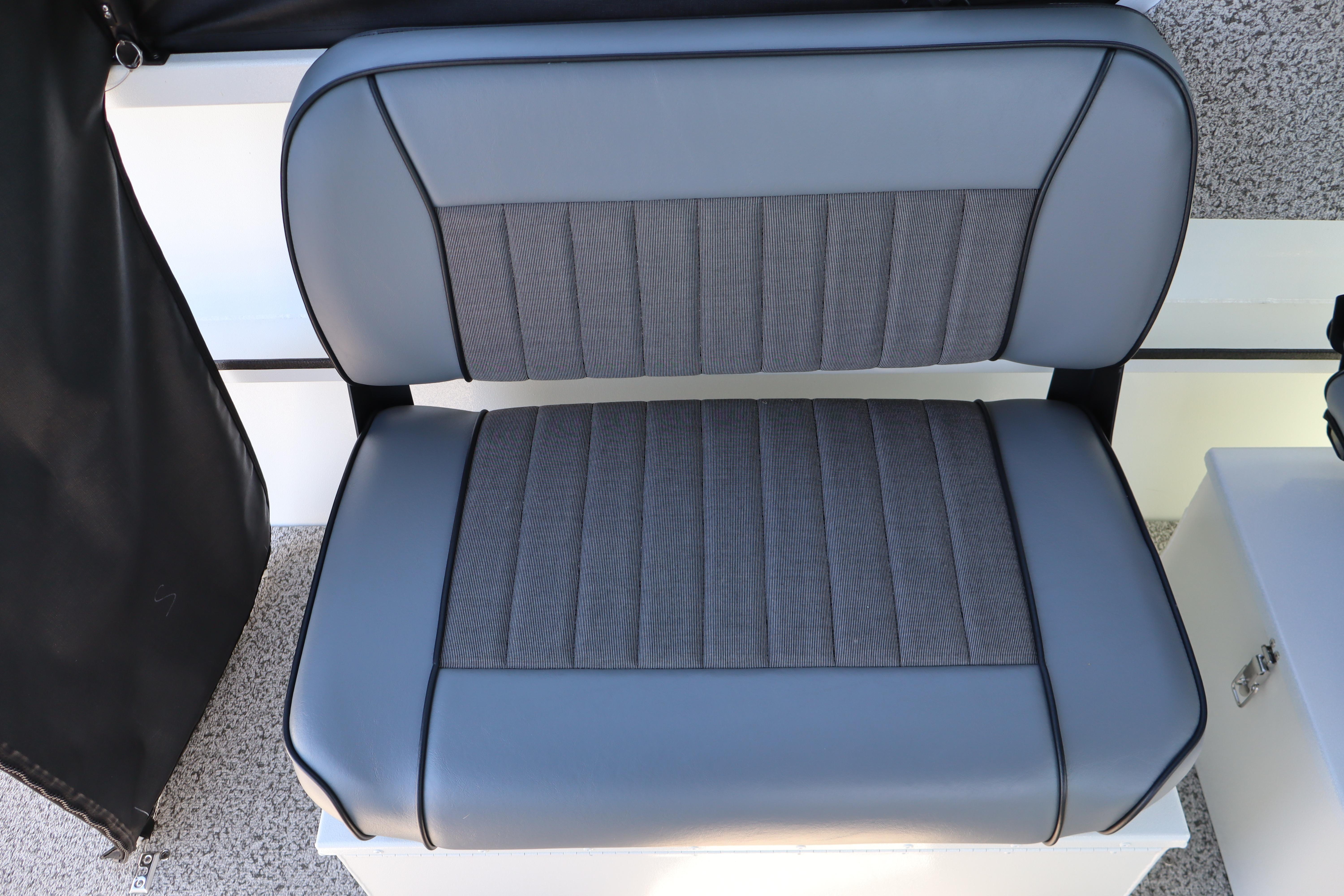 2026 Alumaweld Stryker 202 boat seat with gray upholstery and sleek design.