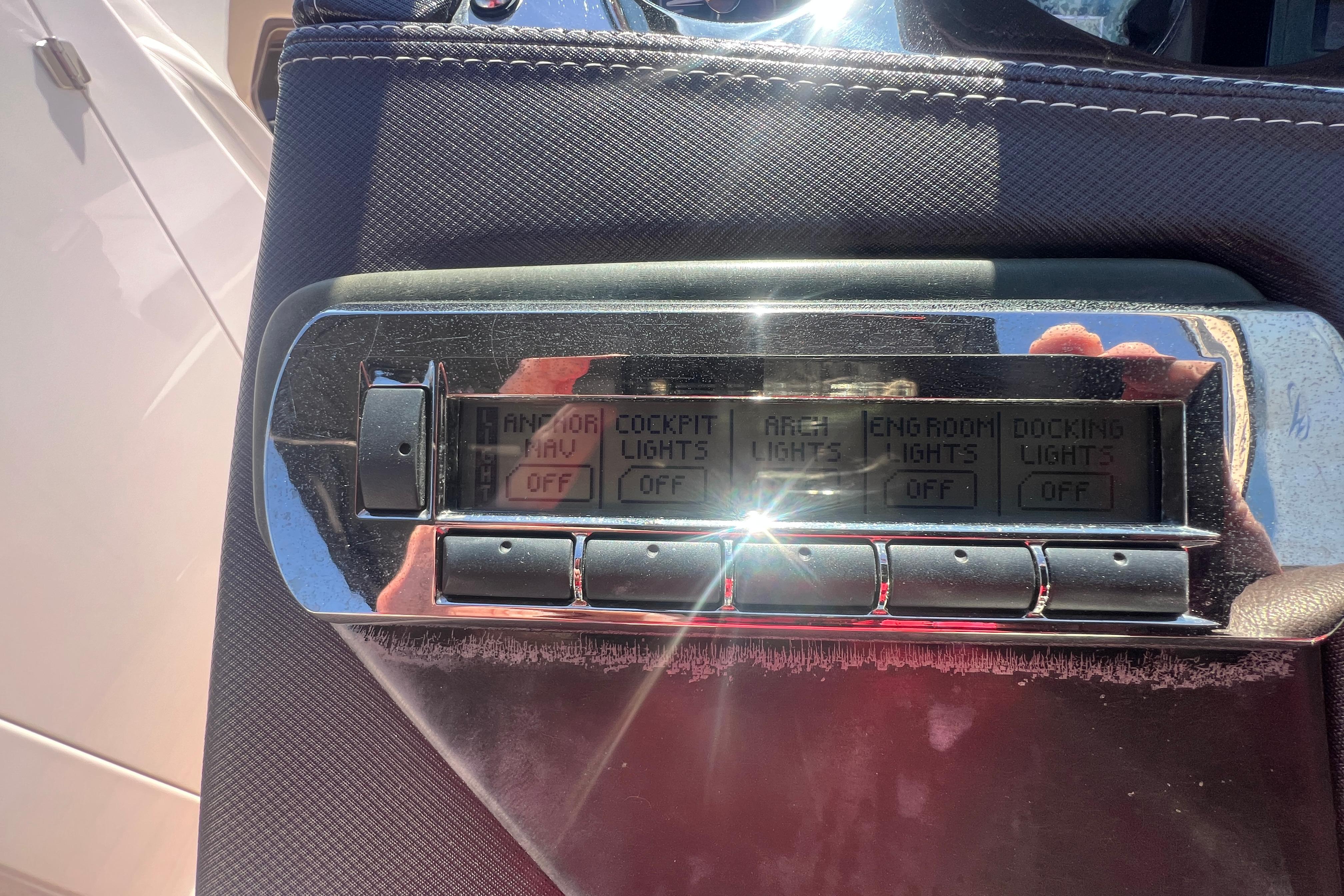 Control panel of a 2017 Monterey 298SS Super Sport boat with various light switches.