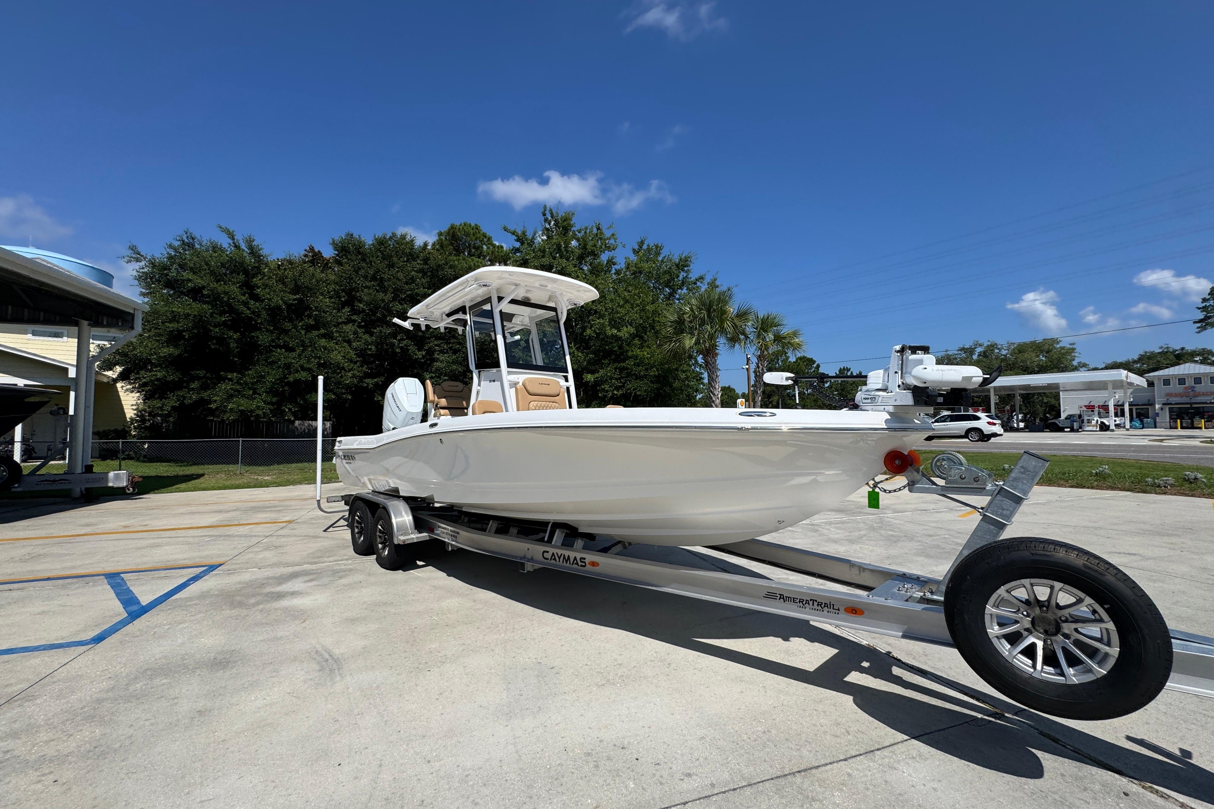 2027 Caymas 26 HB boat on trailer under clear blue sky.