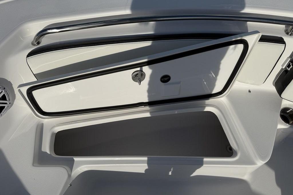 2026 Tidewater 198 CC Adventure boat storage compartment open, showcasing interior space.