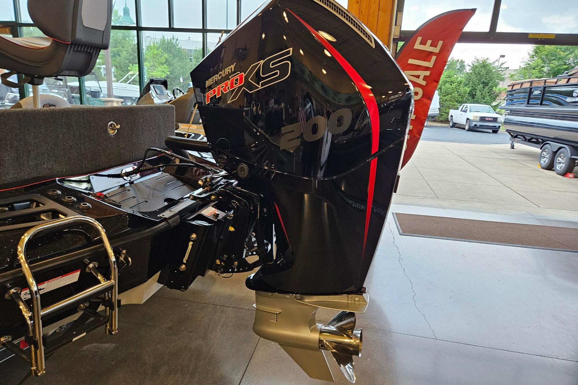 2026 Ranger Z518 Cup-Equipped boat with Mercury Pro XS 200 engine in showroom.