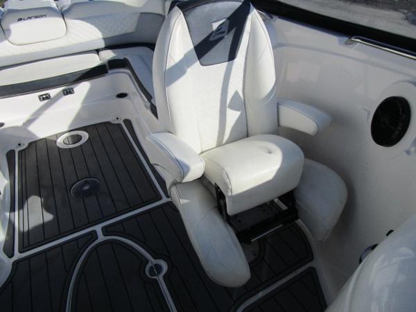 2017 Larson 292 LXI boat interior with white seating and dark flooring.