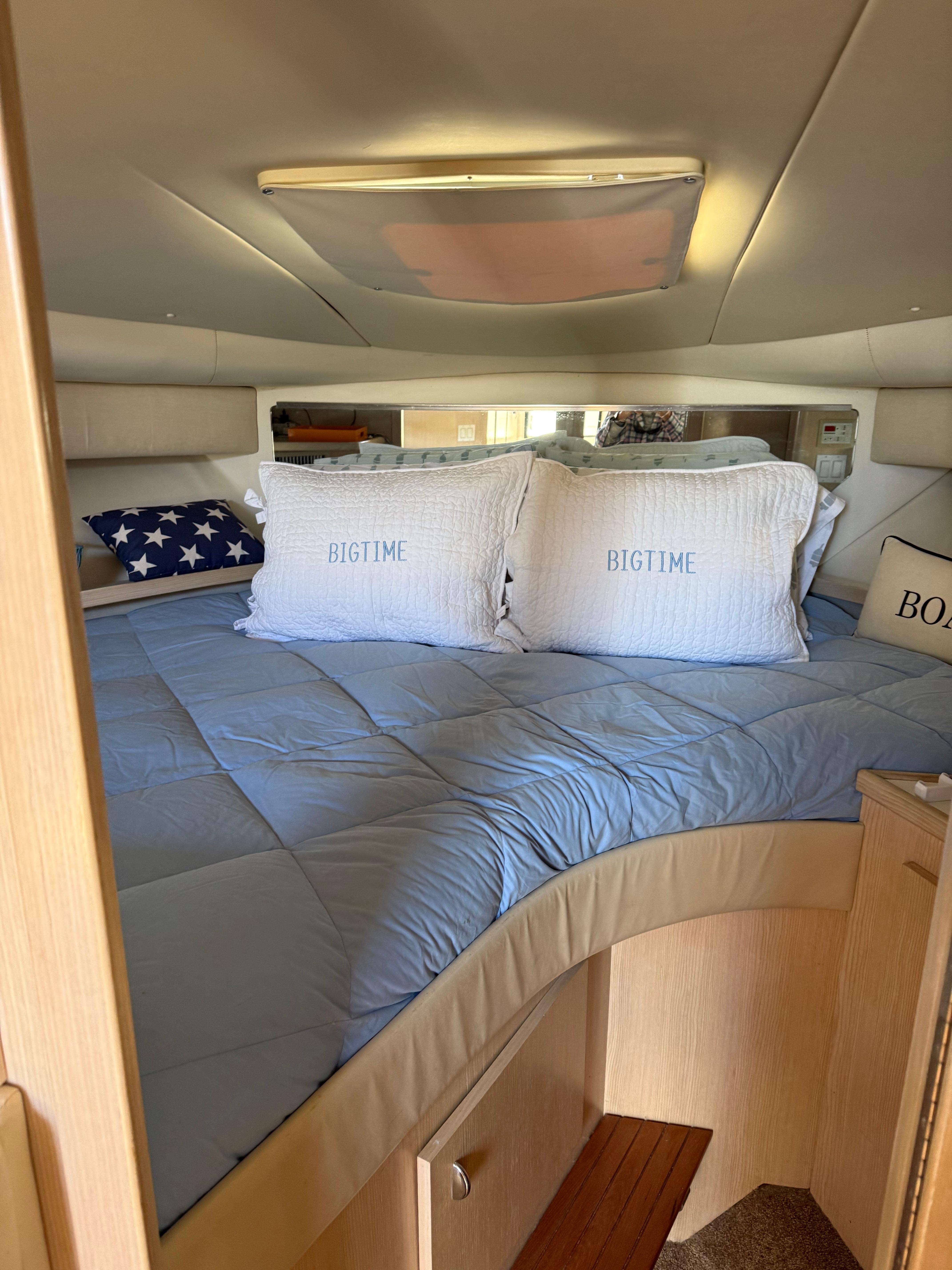Interior of 1996 Tiara Yachts 3500 Express with cozy bed.