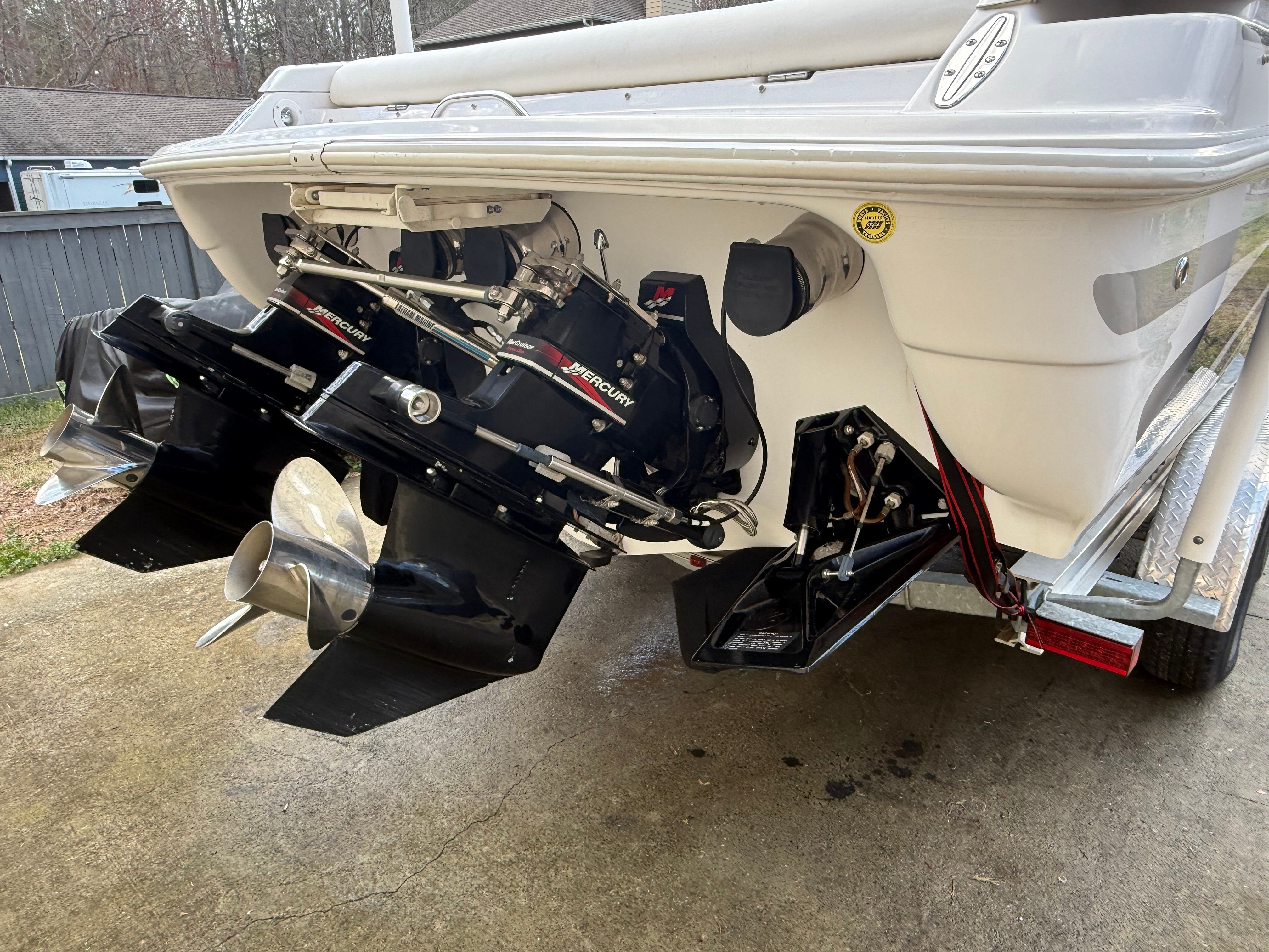 Rear view of a 2003 Donzi 28 ZX with dual powerful outboard engines.