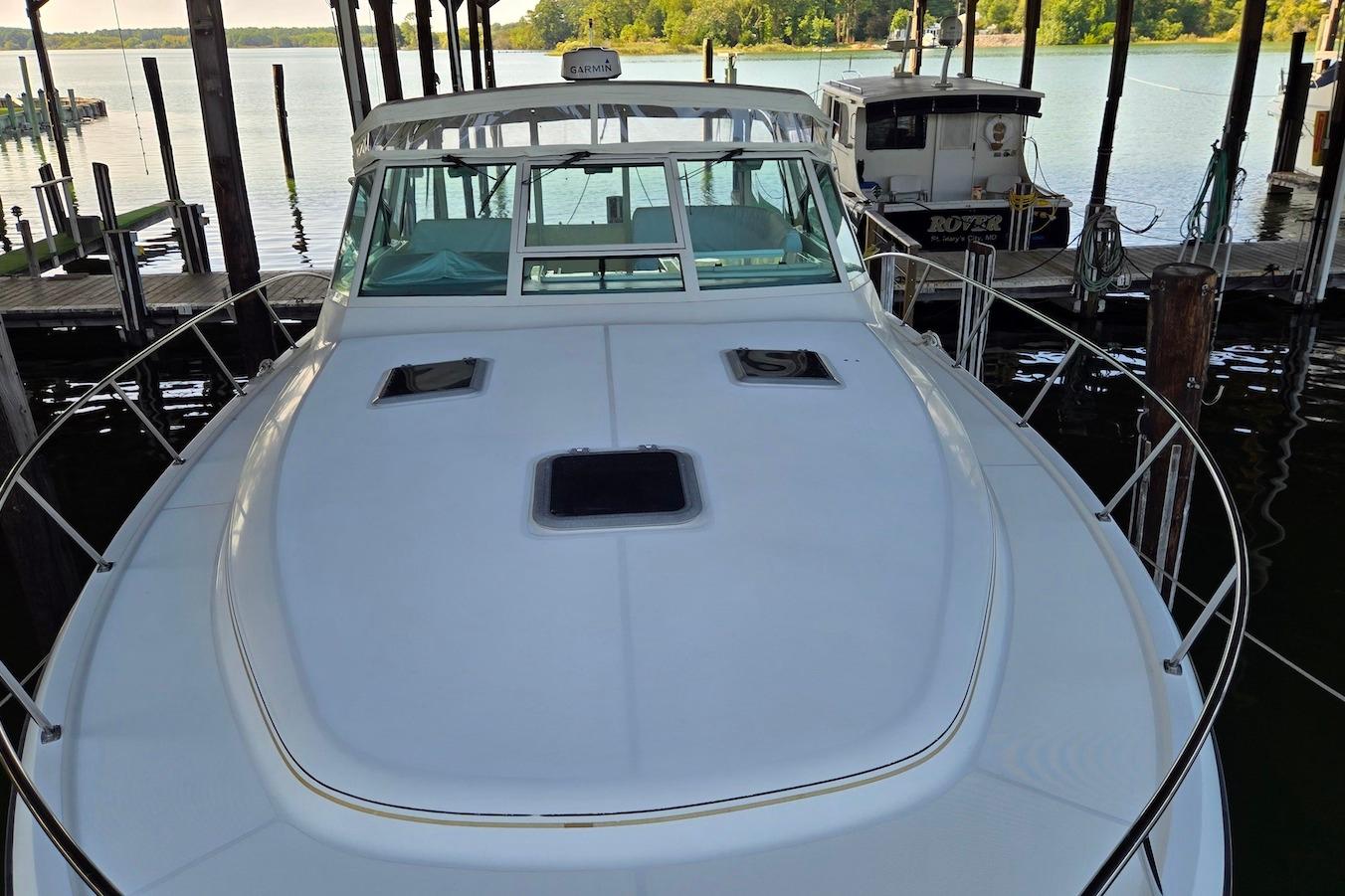 1996 Tiara Yachts 3700 Open docked, showcasing sleek design and spacious deck.
