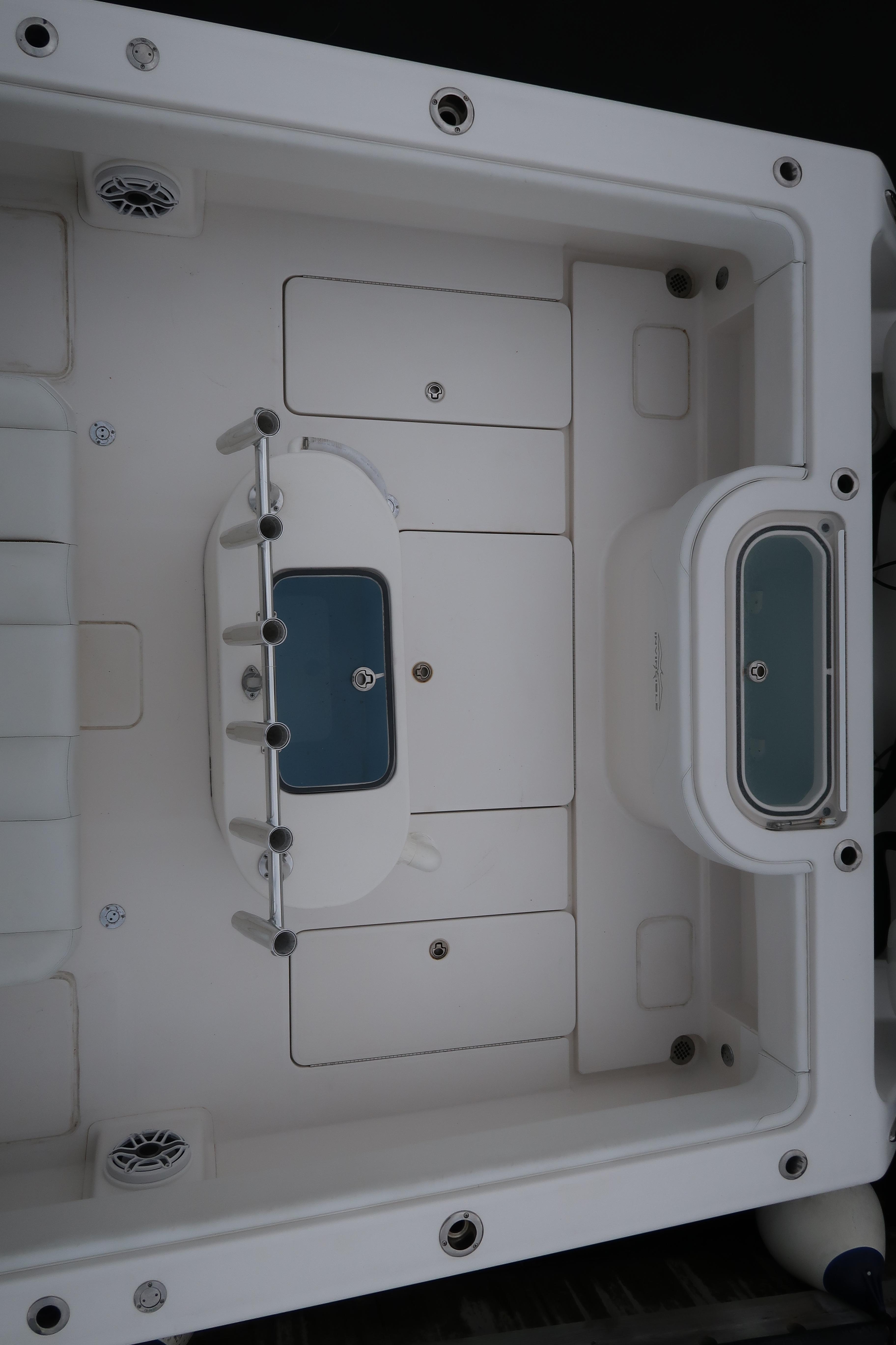 2016 Invincible 42 Open Fisherman boat deck with storage compartments and livewell.
