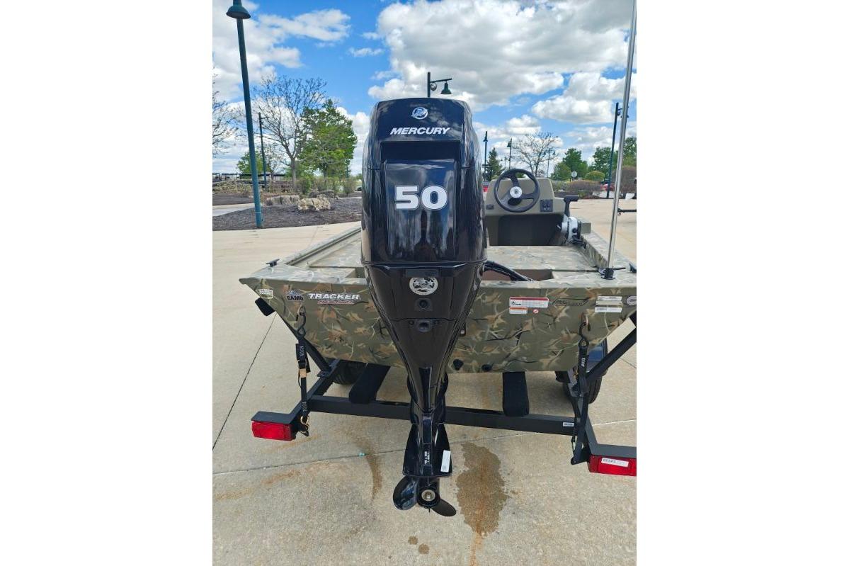 2025 Tracker Grizzly 1648 SC boat with Mercury 50 engine, parked outdoors.
