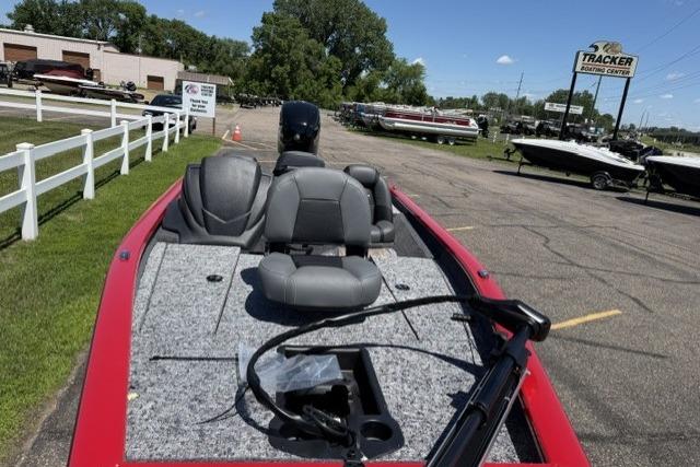 2026 Tracker Pro Team 175 boat at dealership, featuring spacious seating and modern design.