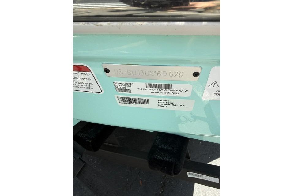 2026 Tahoe T18 boat identification plate with serial numbers and warning labels.