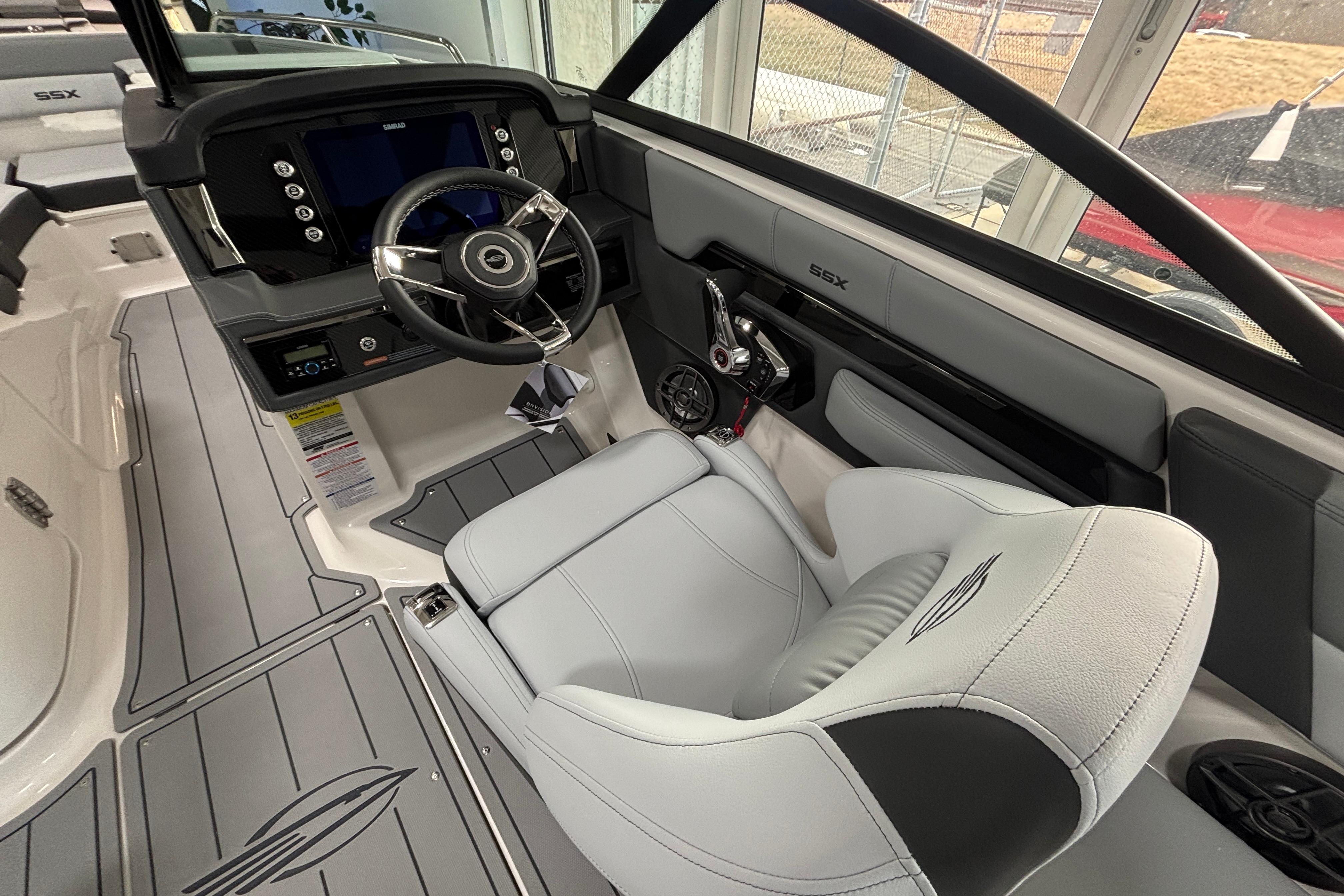 Interior of 2026 Chaparral SSX 4 boat, featuring sleek steering and modern dashboard.