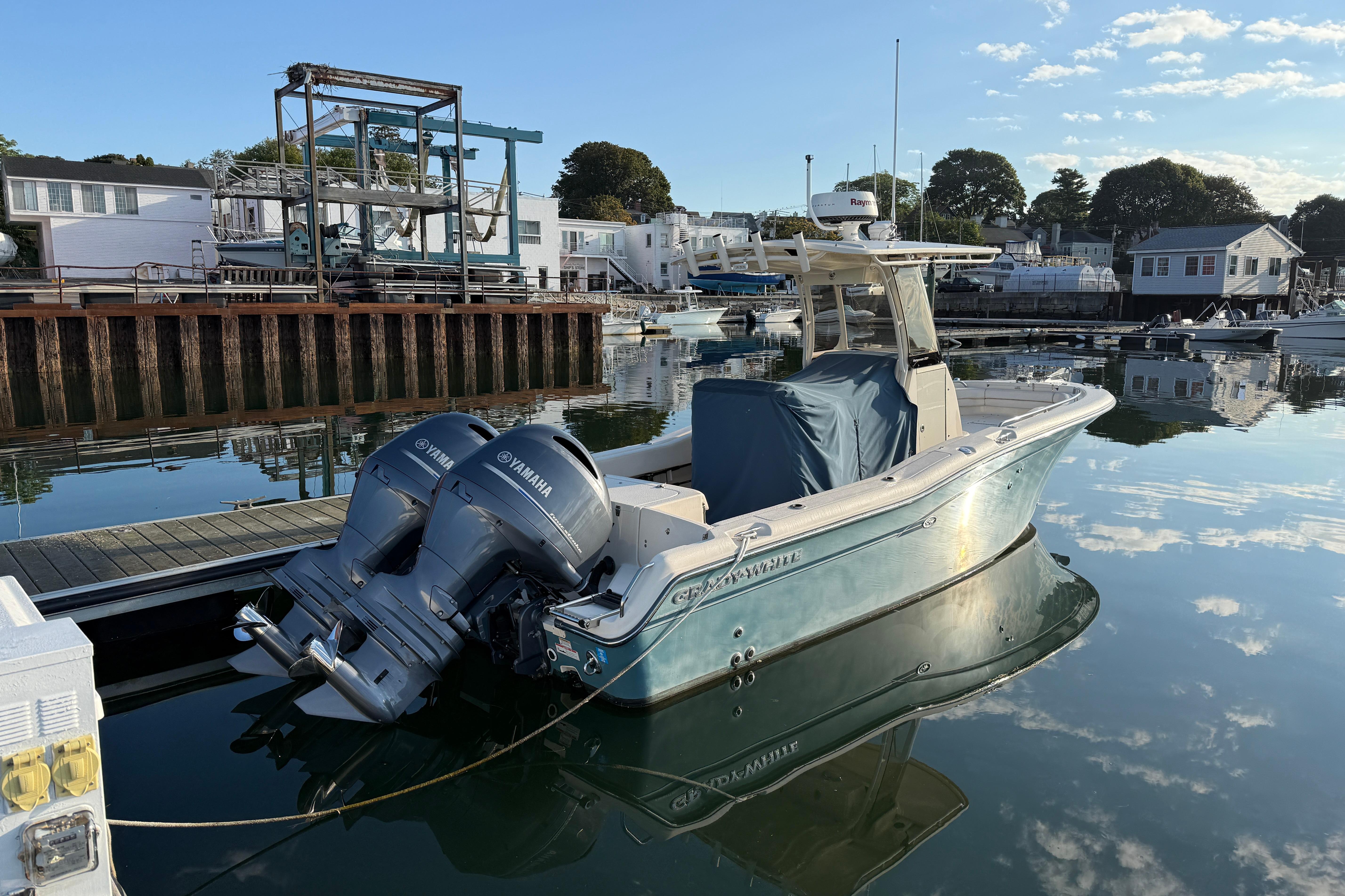2017 Grady White 257 Fisherman boat docked with twin Yamaha engines.