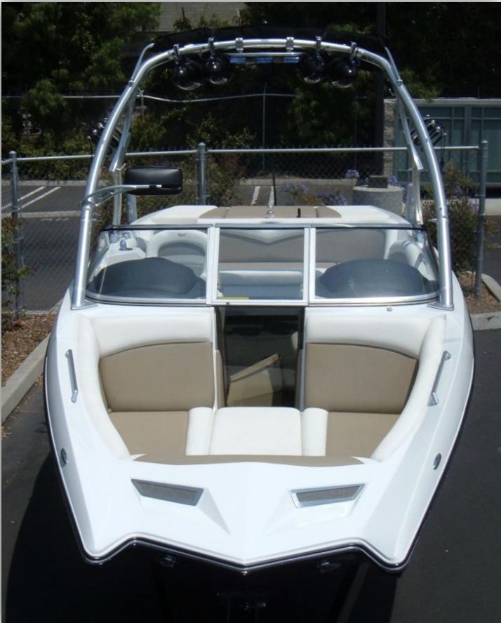 2008 Tigé RZ4 with sleek tower and beige interior, parked in a lot.