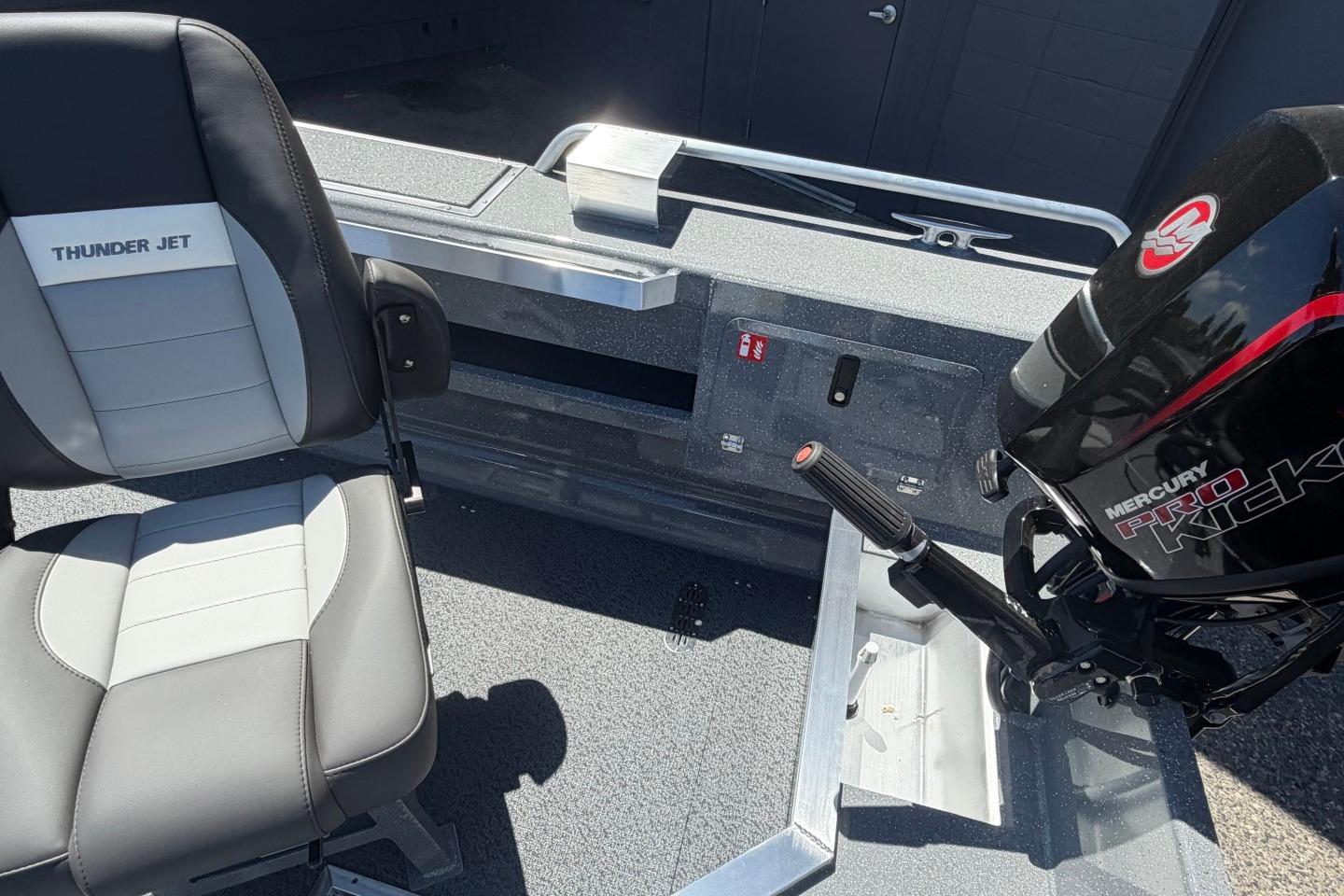 2026 Thunder Jet 209 Rush OT boat interior with Mercury Pro Kick motor and seating.