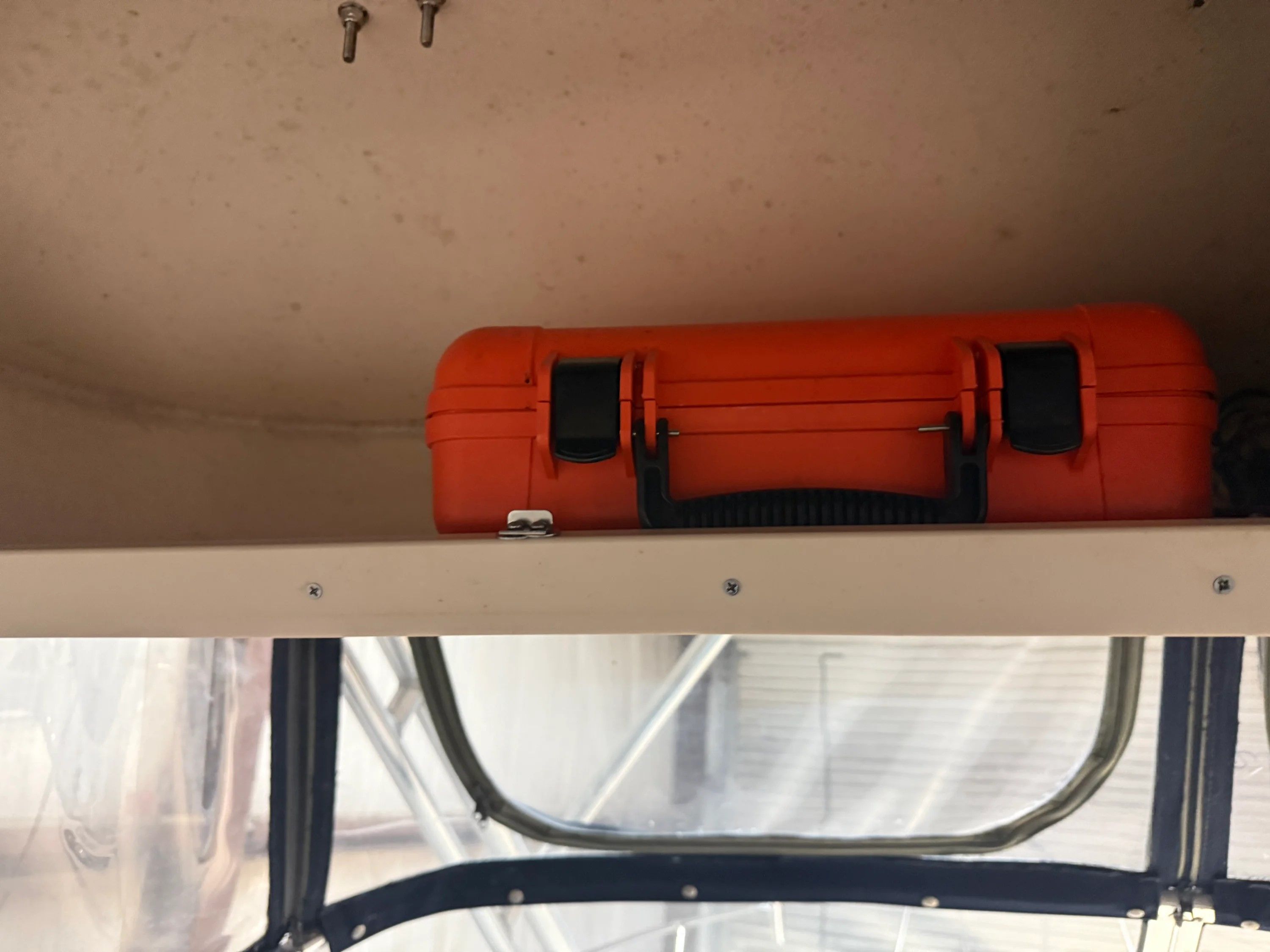 Orange case inside a 2002 Grady-White Marlin 300 boat.