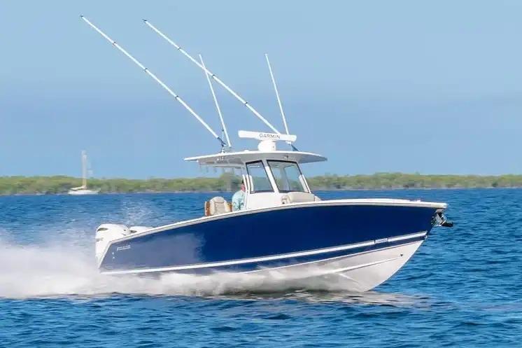 Manufacturer Provided Image: 2026 Jupiter 340LS boat cruising on open water under clear blue skies.